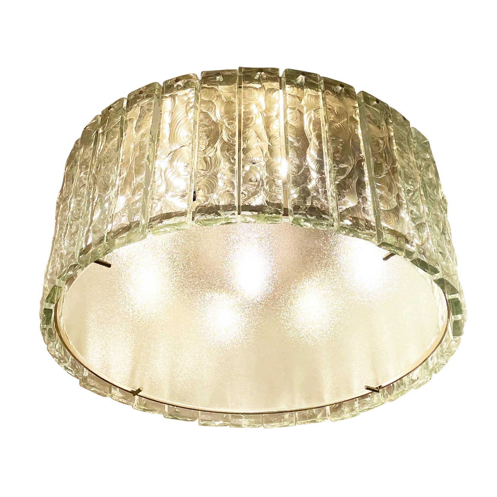 Fontana Arte ceiling light model 2448 designed by Max Ingrand in the 1960s. Features a nickel-plated structure holding dozens of chiseled glasses. Closed at the bottom by a frosted glass diffuser. Holds eight candelabra sockets and one Edison