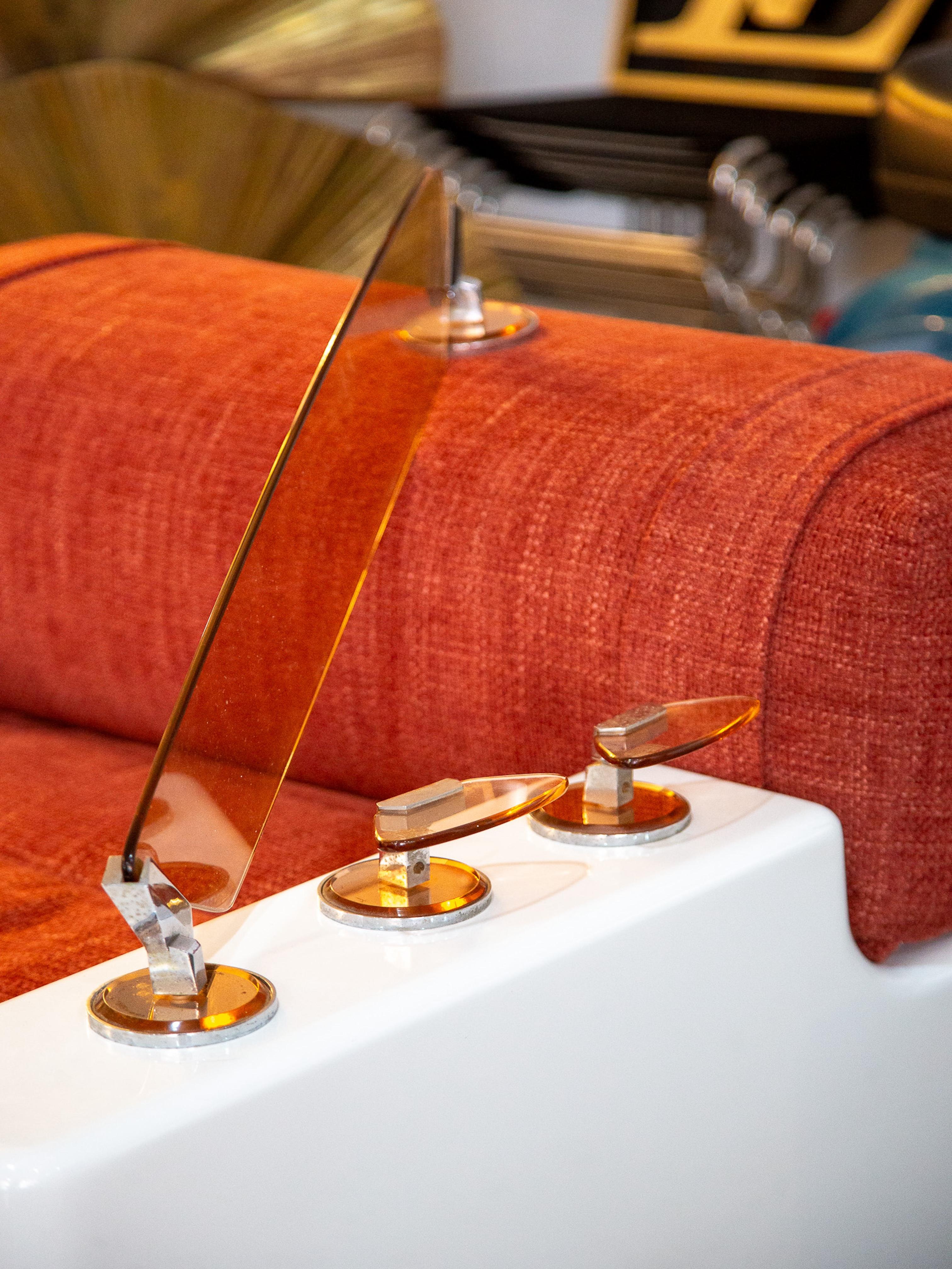 Please get in touch for dimensions of each piece 
A rare and complete vintage bathroom set by Veca, dating to the 1960s. This sculptural ensemble includes an illuminated wall mirror, a pair of glass and chromed sconces, a frosted globe wall light,