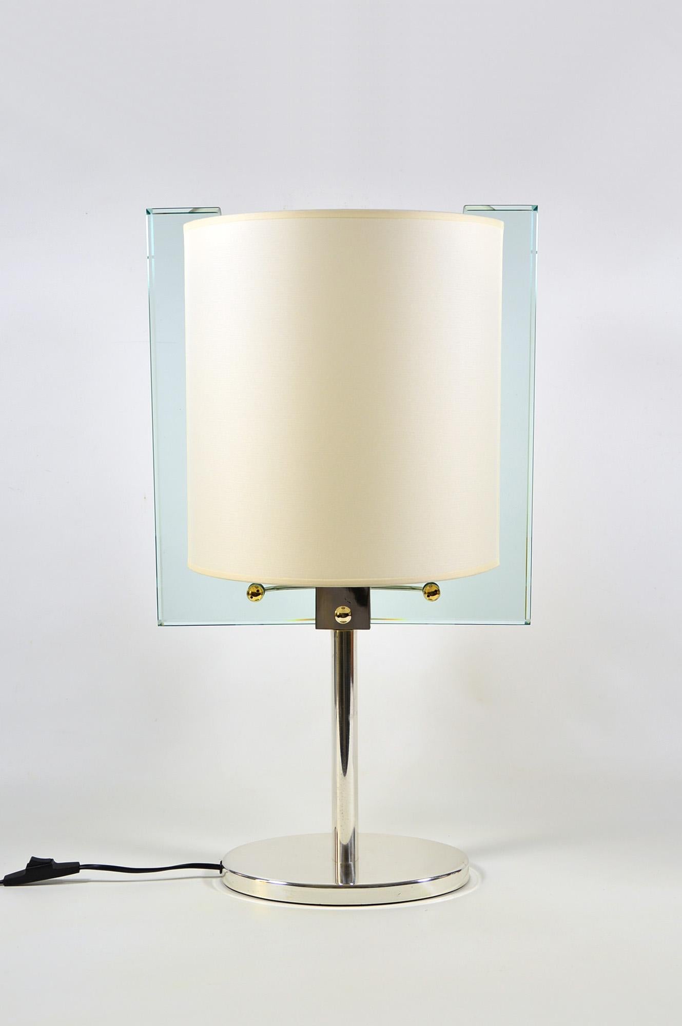 Table lamp model 2833 designed, circa 1990 by Nathalie Grenon for Fontana Arte, with a silver plated brass body and a unique shade made of fabric and thick crystal. 
It carries four bulbs with E14 screw sockets.
In very good condition, with minor