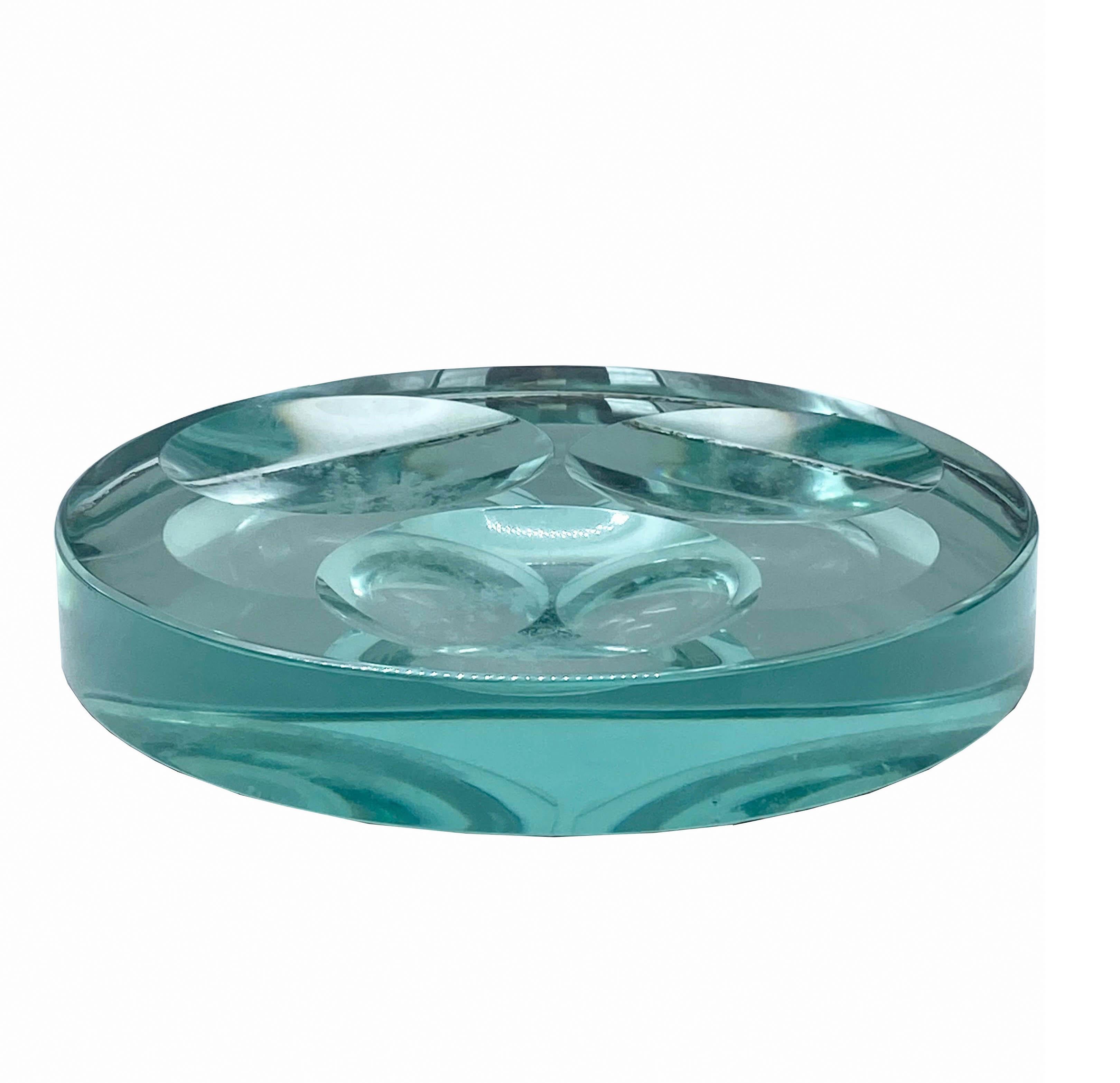 Fontana Arte, pocket tray or ash tray or centerpiece in cut glass circular base with four concave circles inside from 1950s.