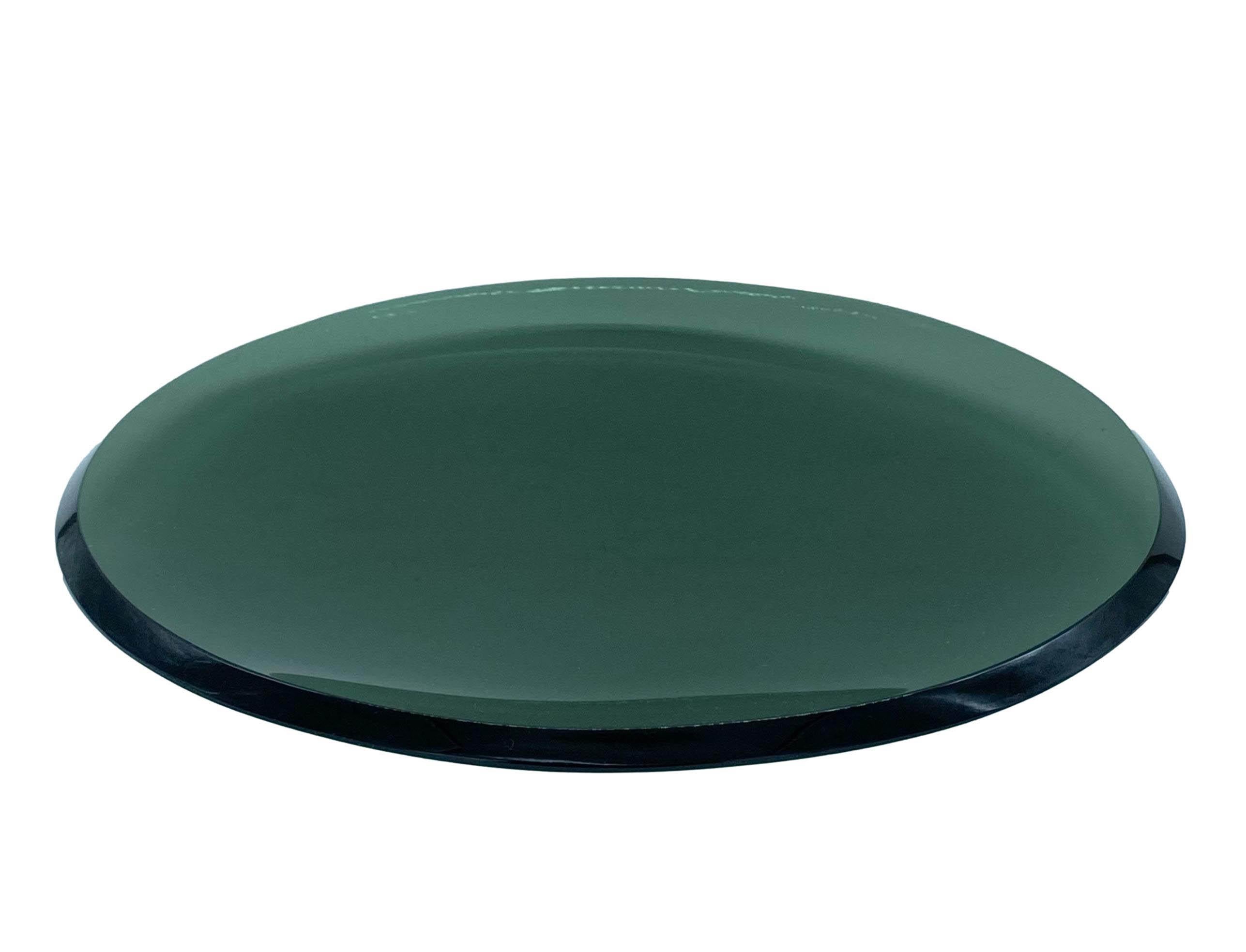 This rare and delightful glass centrepiece has a round shape with slightly rounded edges and a sunken centre, and consists of three overlapping plates of three different sizes. The subtle green glass colour, delicate curves and bevelled edges