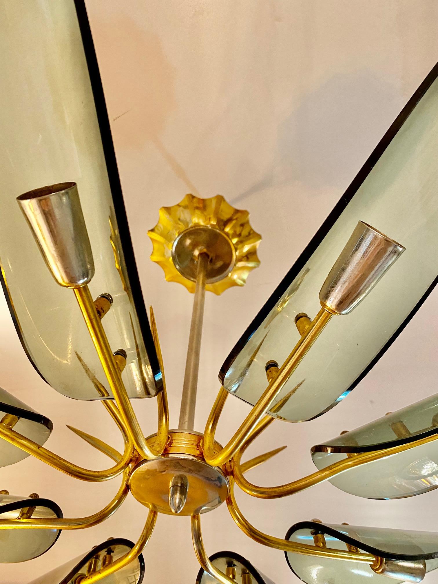 Superb chandelier with glass oversized 93 cm with gilt gold structure. The Design and the quality of the glass make this piece the best of the italian Design.

This Pieces of Arts glass show the exclusive design of Italian Designer in 1960/70.