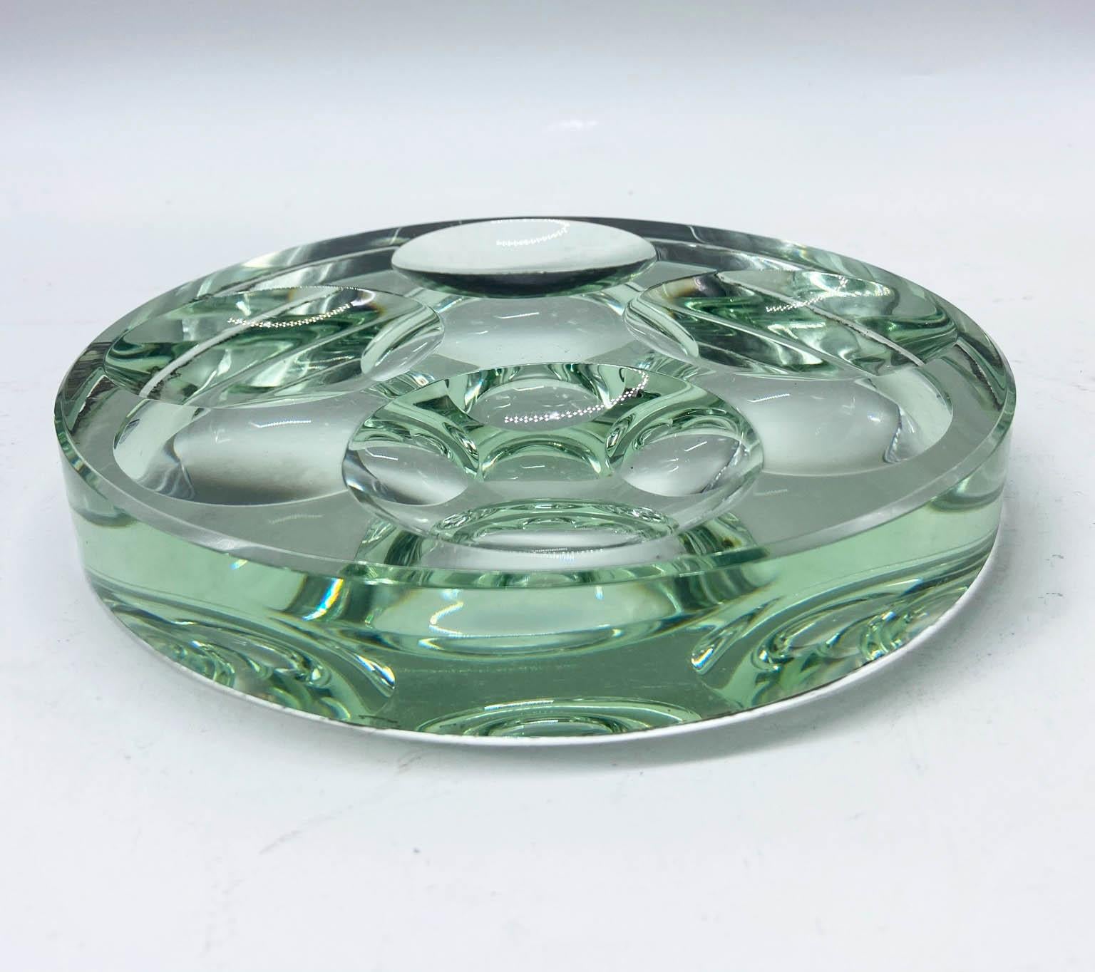 Fontana Arte, pocket tray or ash tray or centerpiece in cut glass circular base with four concave circles inside from 1950s.