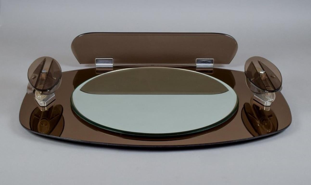 Fontana Arte, Italy. Large wall mirror in smoked-coloured frame.
1980s.
In perfect condition.
Dimensions: Width 81.0 cm x Hight 61.0 cm x Depth 10.5 cm.