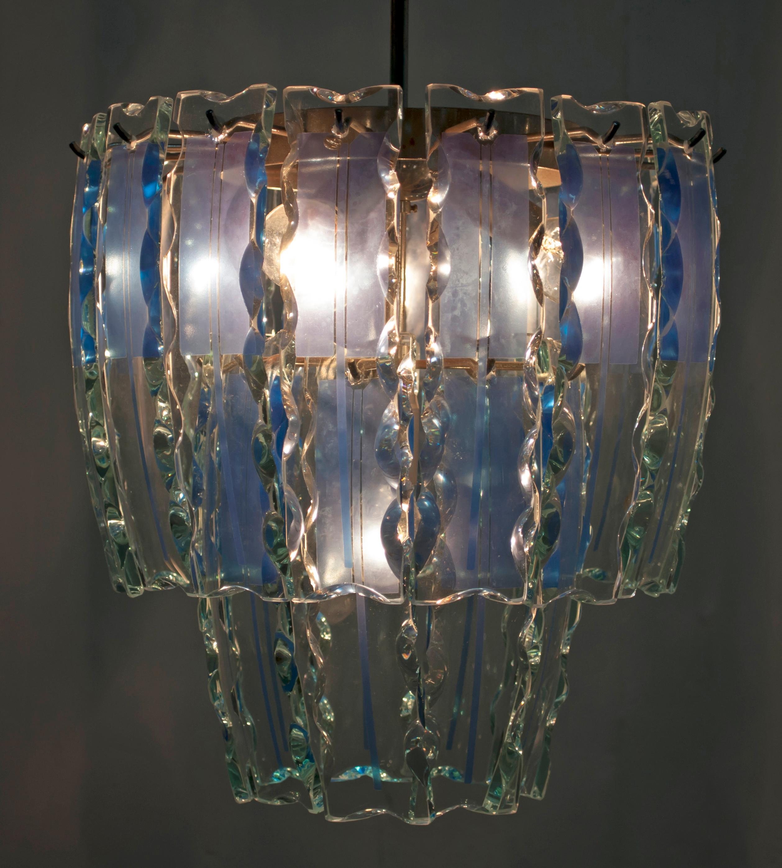 This four-light chandelier was made by Fontana Arte in chiseled Murano glass in a blue and transparent color.

Fontana Arte S.p.A. is an Italian company founded in Milan (as Fontana Arte) in 1932 by Luigi Fontana and Giò Ponti and specialized in