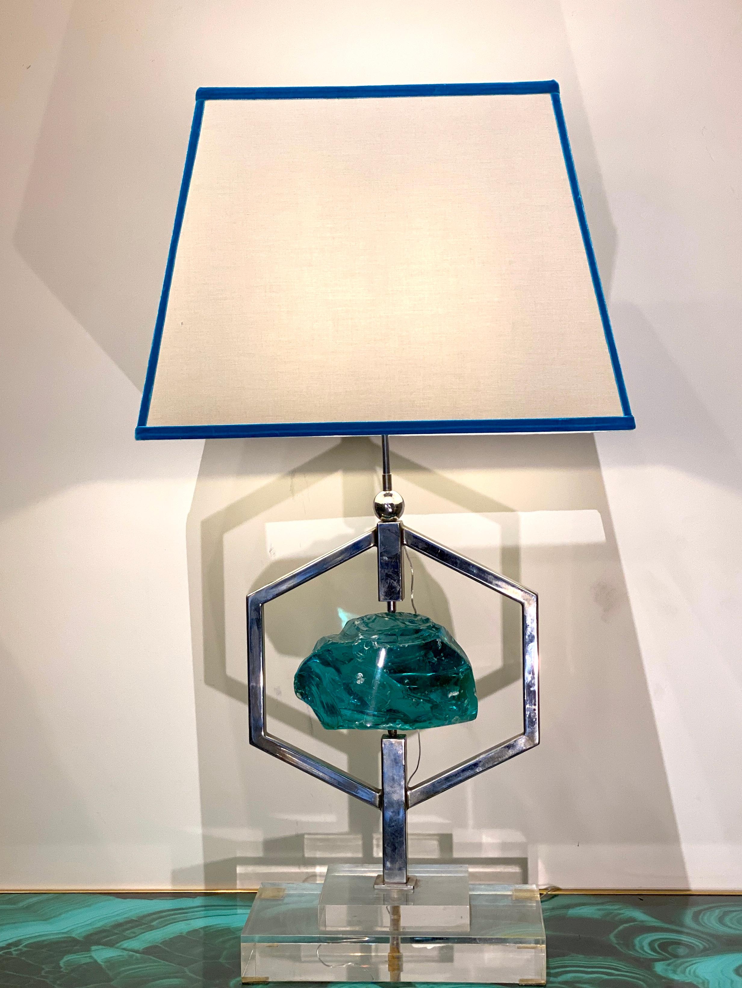 Pair of spectacular Table lights centered by a chiseled emerald green colored crystal in nickel-plated support on a plexiglass base , attributed to Max Ingrand . Each one of these table lamps is unique owing to the differences in glass production .
