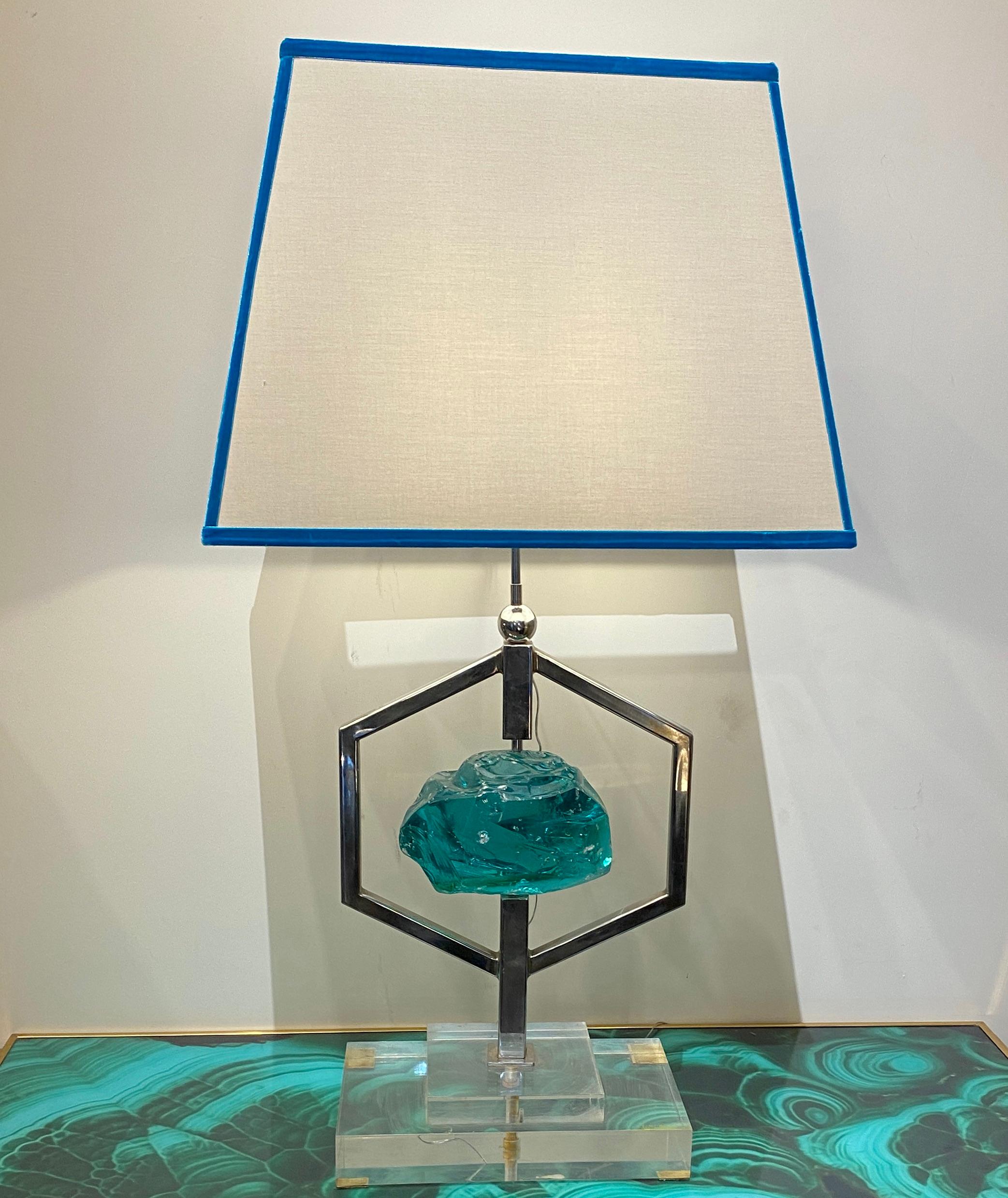Pair of spectacular Table lights centered by a chiseled emerald green colored crystal in nickel-plated support on a plexiglass base , attributed to Max Ingrand . Each one of these table lamps is unique owing to the differences in glass production .