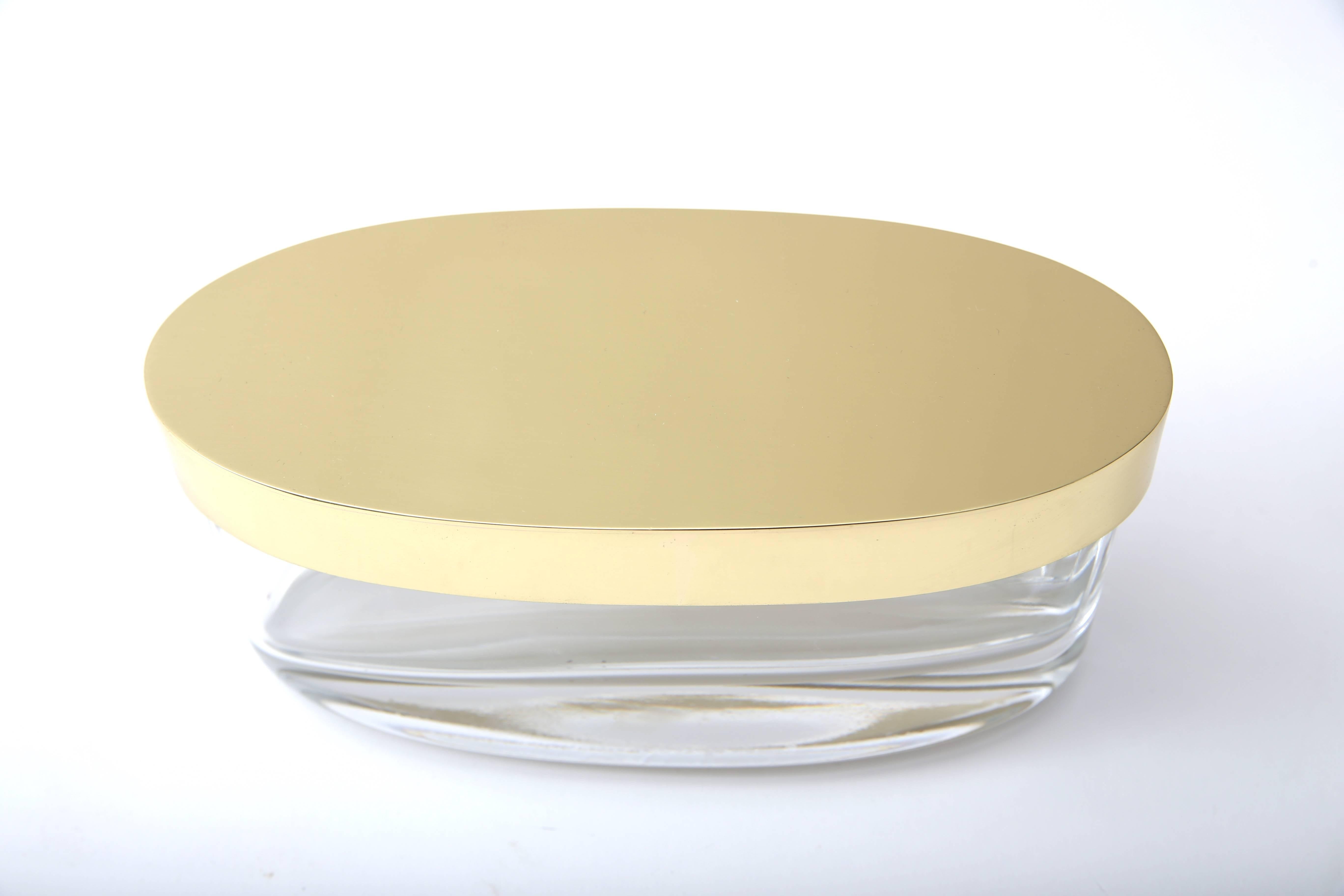 This stylish and exquisite box was created by the iconic firm of Fontana Arte and dates to the late 20th century. With its clean lines and simple form this piece could be used on ones dressing table or desk.

Note: The brass has been