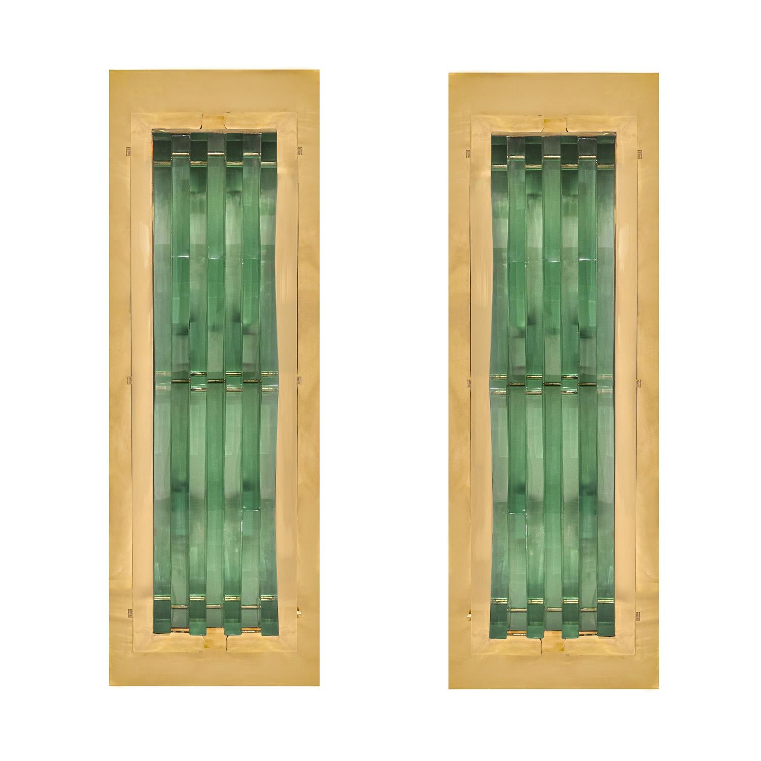 Pair of stunning large wall sconces in polished brass with handcut angular glass inserts by Max Ingrand for Fontana Arte, Italy 1950s. These sconces have been polished, lacquered and newly rewired. 

Reference:
Fontana Arte: Gio Ponti, Pietro