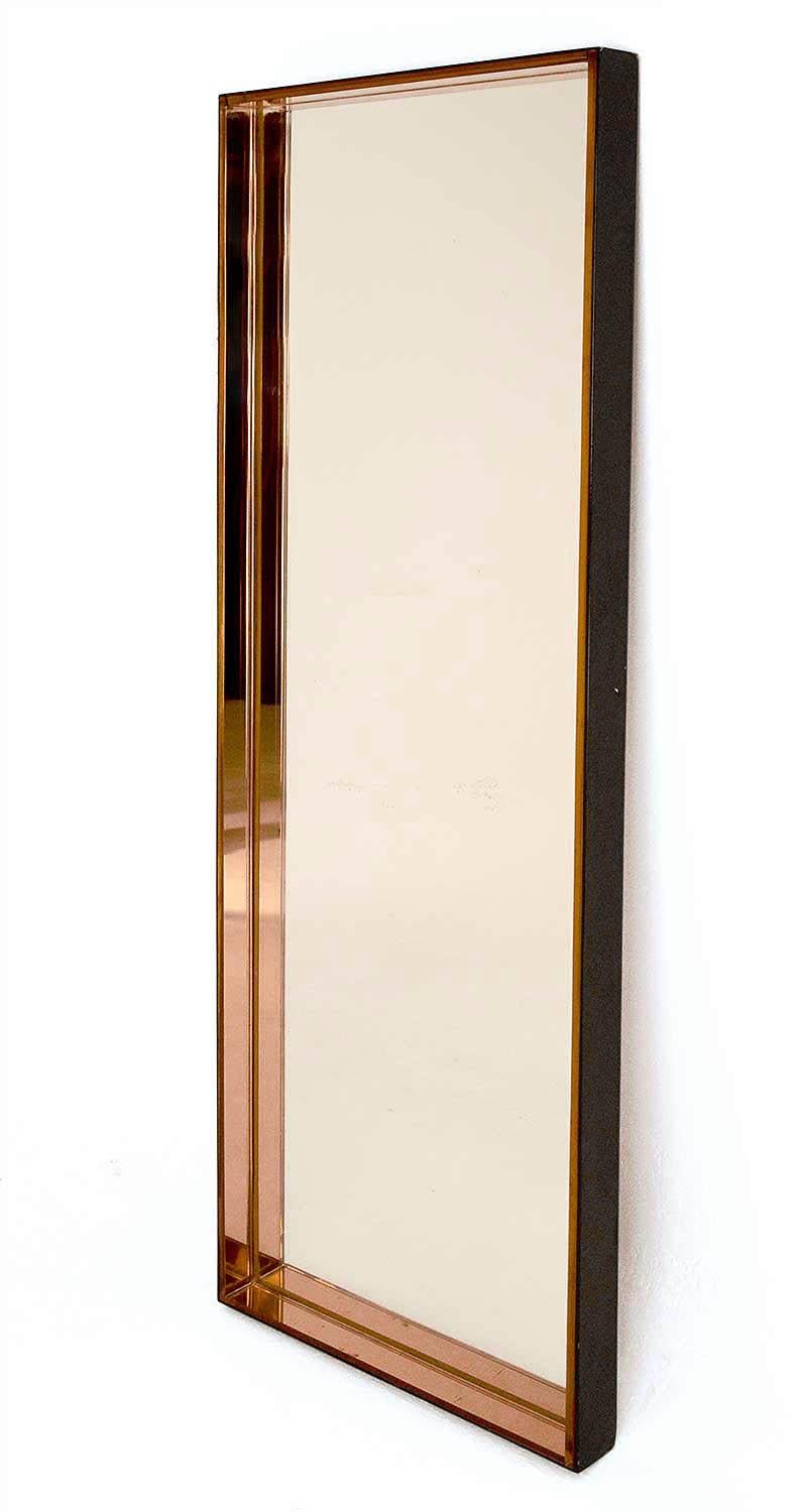 Rectangular mirror with two colors: clear neutral background mirror and inner frame covered with pink mirrors. Black lacquered metal outside frame, slight spot visible on one side.
Good condition.
Work from the 1960s-1970s in the style of the