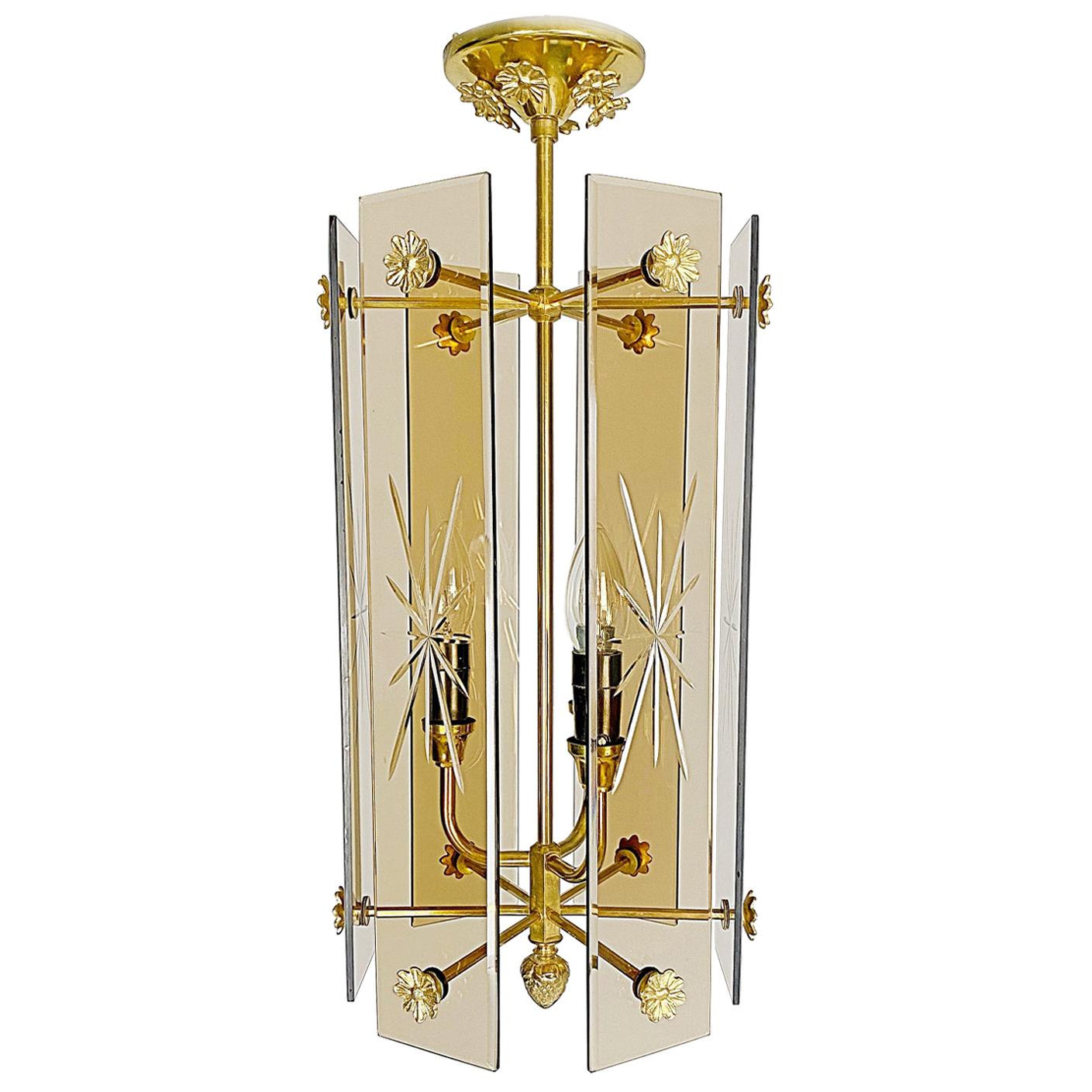 Beautiful Italian designer lantern made of brass and hand-carved, smoked glass, proving high-quality craftsmanship. Excellent original condition with a lovely patina. Three E14 Edison standard sockets, the lantern works on 110V - 240V.

we ship with