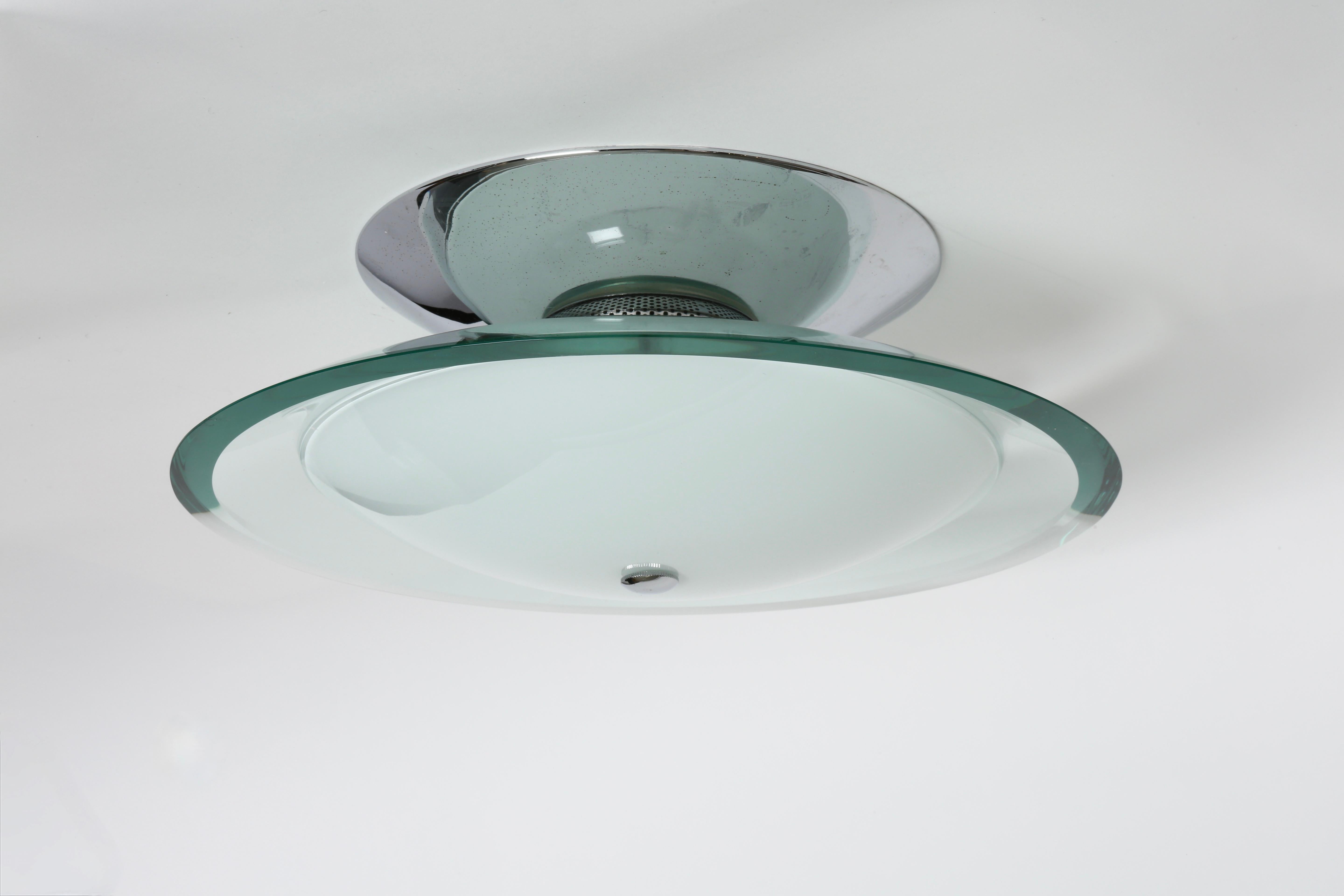 Fontana Arte style ceiling light.
Made in Italy in 1960s.
Two kinds of glass.
Takes 4 candelabra bulbs.
Complimentary US rewiring upon request.
FREE US rewiring upon request.
FREE US Continental shipping.
NO TARIFFS, Duties or Customs fees on US