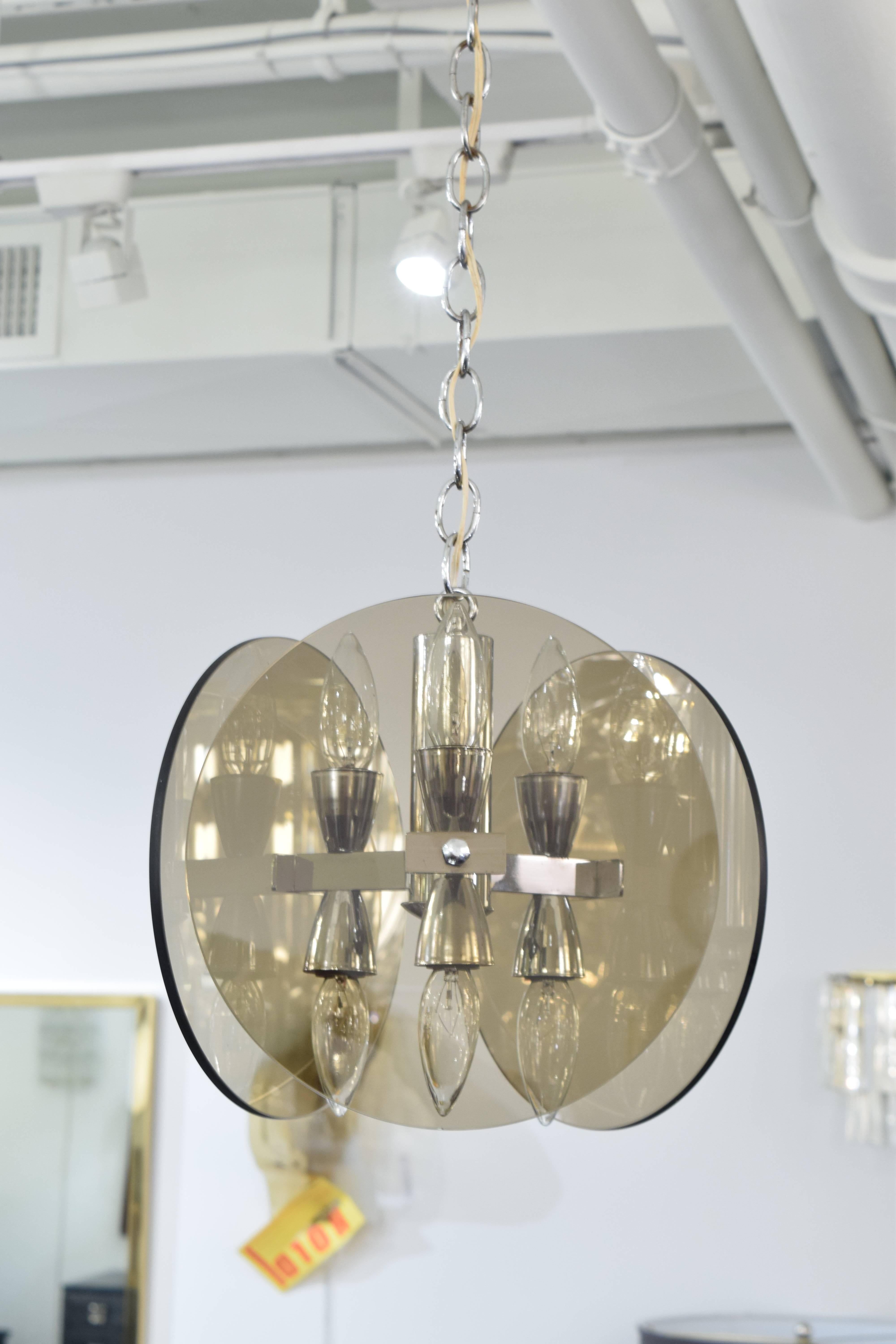 A smoked glass three bulb chandelier in the style of Fontana Arte, with three glass circles each with a diameter of 12