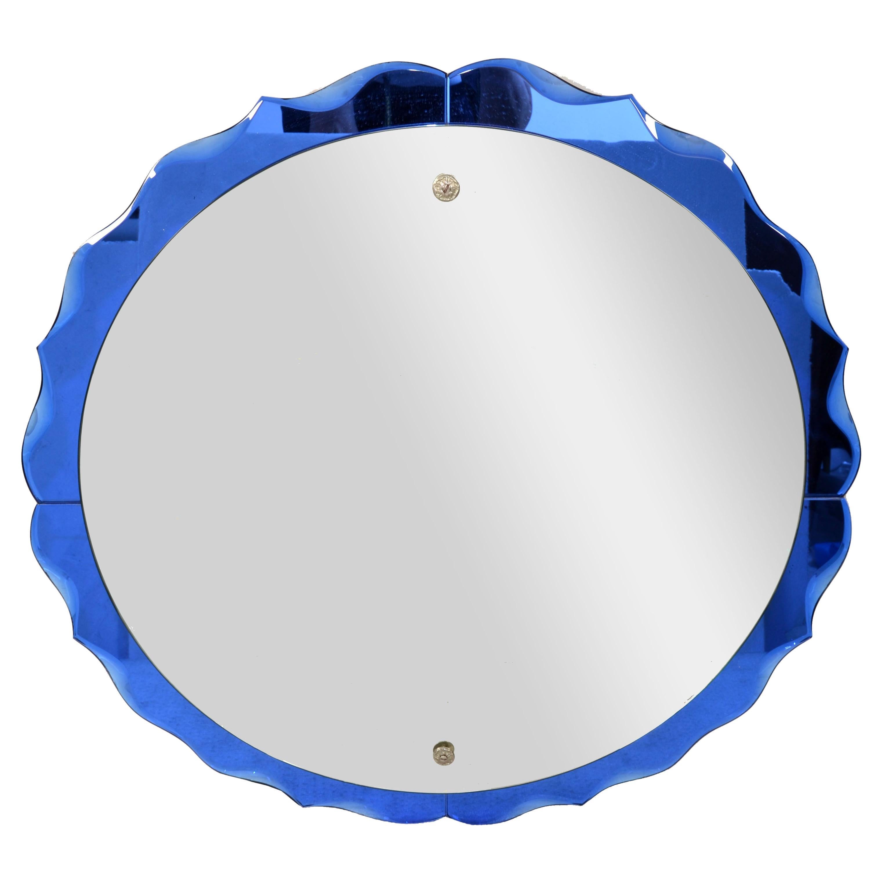 Fontana Arte Style curved beveled round double Glass Wall Mirror, in Cobalt Blue Color, no Frame with wooden backing.
Italian Mid-Century Modern Period made in the late 1960s.
Blue colored beveled mirror glass on a wooden backing.
Overall, a Classic
