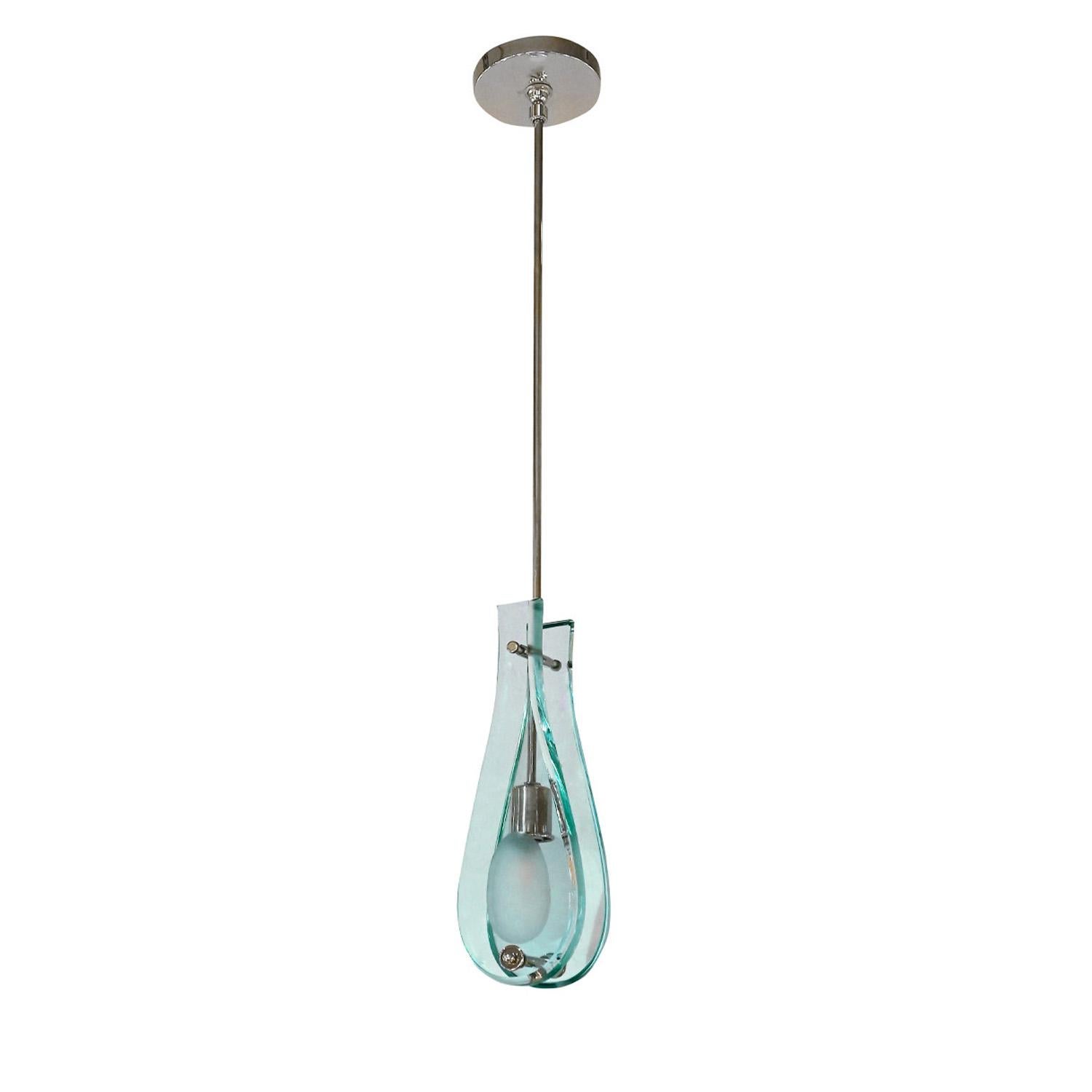 Pendant light with bilateral hand-cut glass facades and chrome hardware in the manner of Fontana Arte, Milan Italy, 1950's. Newly rewired by Lobel Modern - it now has an American candelabra socket (originally had European sockets). A timeless