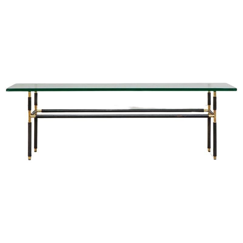 This beautiful coffee table is designed by Pietro Chiesa for Fontana Arte. Model 1736 Italy, 1950s 
This table is made with a beautiful green colored glass with metal and brass. You can find this in the Fontana Arte Manufacturer's Catalog, 1964.
