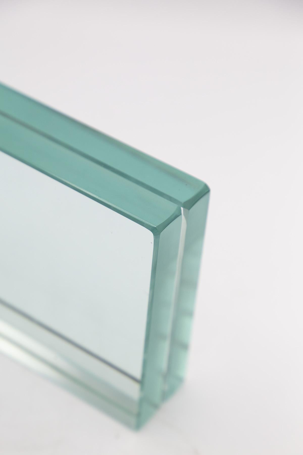 Rare glass photo frame made in the 1960s by Fontana Arte.
The photo holder has a classic rectangular shape with frosted corners, made entirely of glass.
It is created from two thick sheets of excellent hand-crafted glass, which come together at