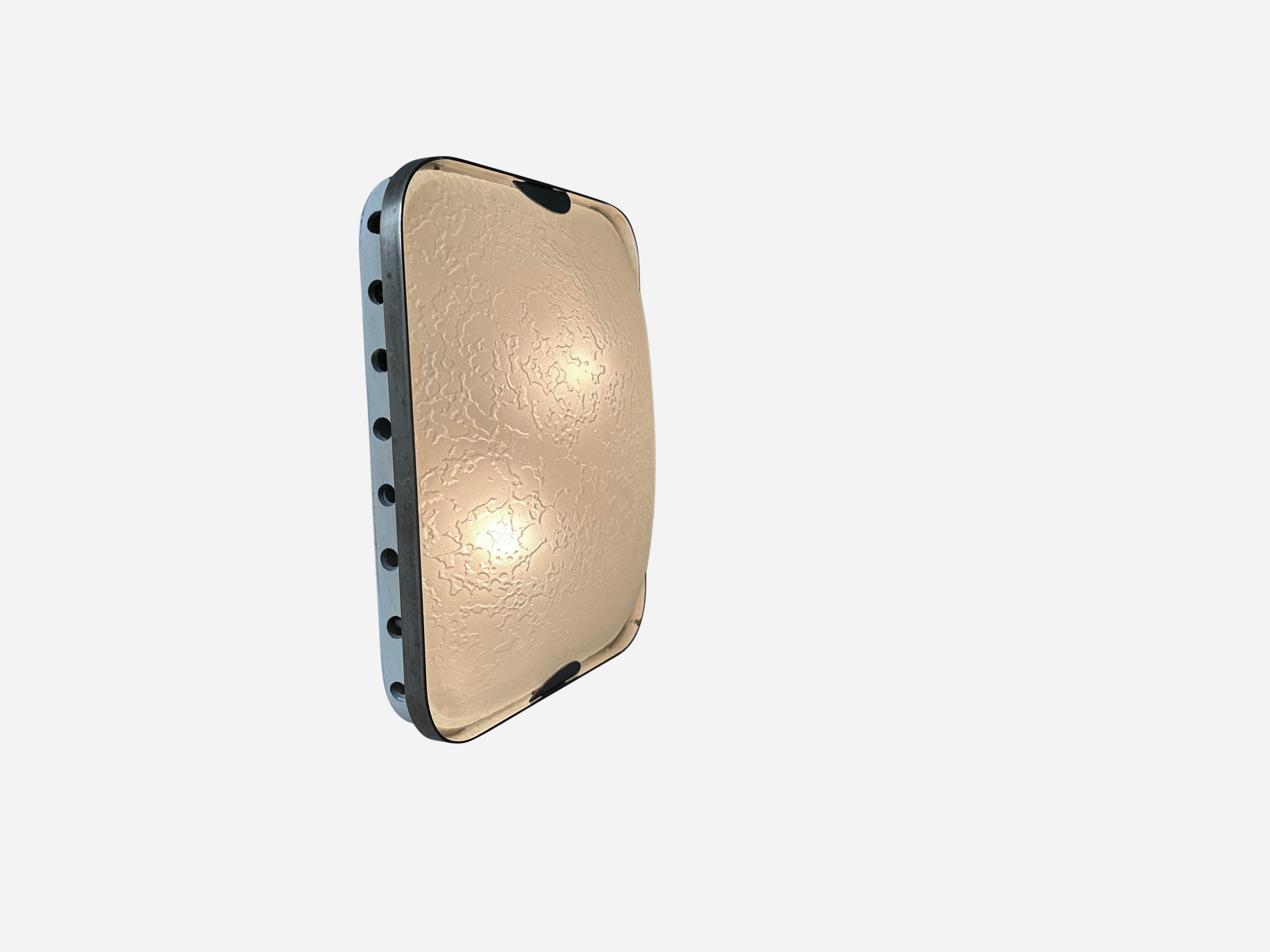 Fontana Arte sconce.
Designed and manufactured in Italy 1960s.
Textured glass, brass, enameled metal.
Takes 2 candelabra bulbs.
Complimentary US rewiring upon request

We take pride in bringing vintage fixtures to their full glory again.
At