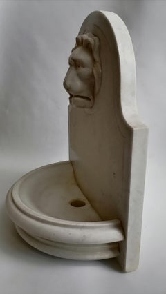 White Carrara marble fountain with carved lion snout -made in Italy