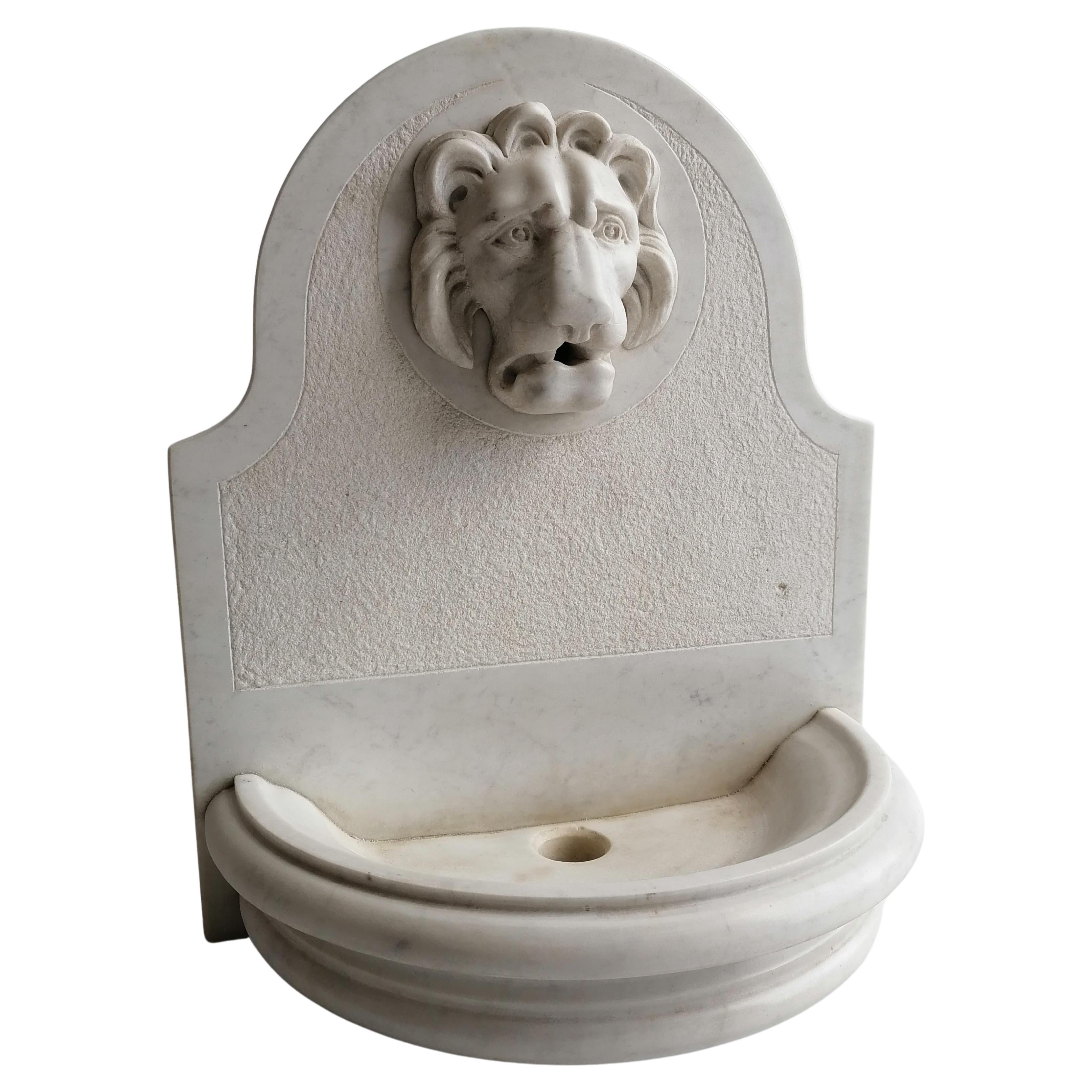 White Carrara marble fountain with carved lion snout -made in Italy For Sale