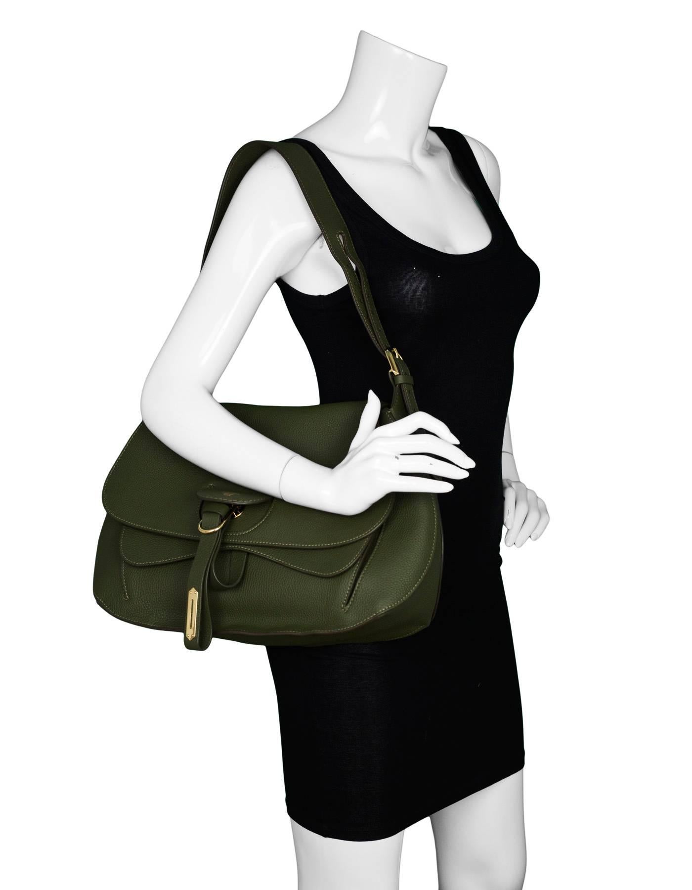 Fontana Milano 1915 Green Weight Medium Saddle Hobo

Made In: Italy
Color: Green
Hardware: Goldtone
Materials: Leather, metal
Lining: Tan leather
Closure/Opening: Flap top
Exterior Pockets: One pocket under flap, one pocket at back
Interior Pockets: