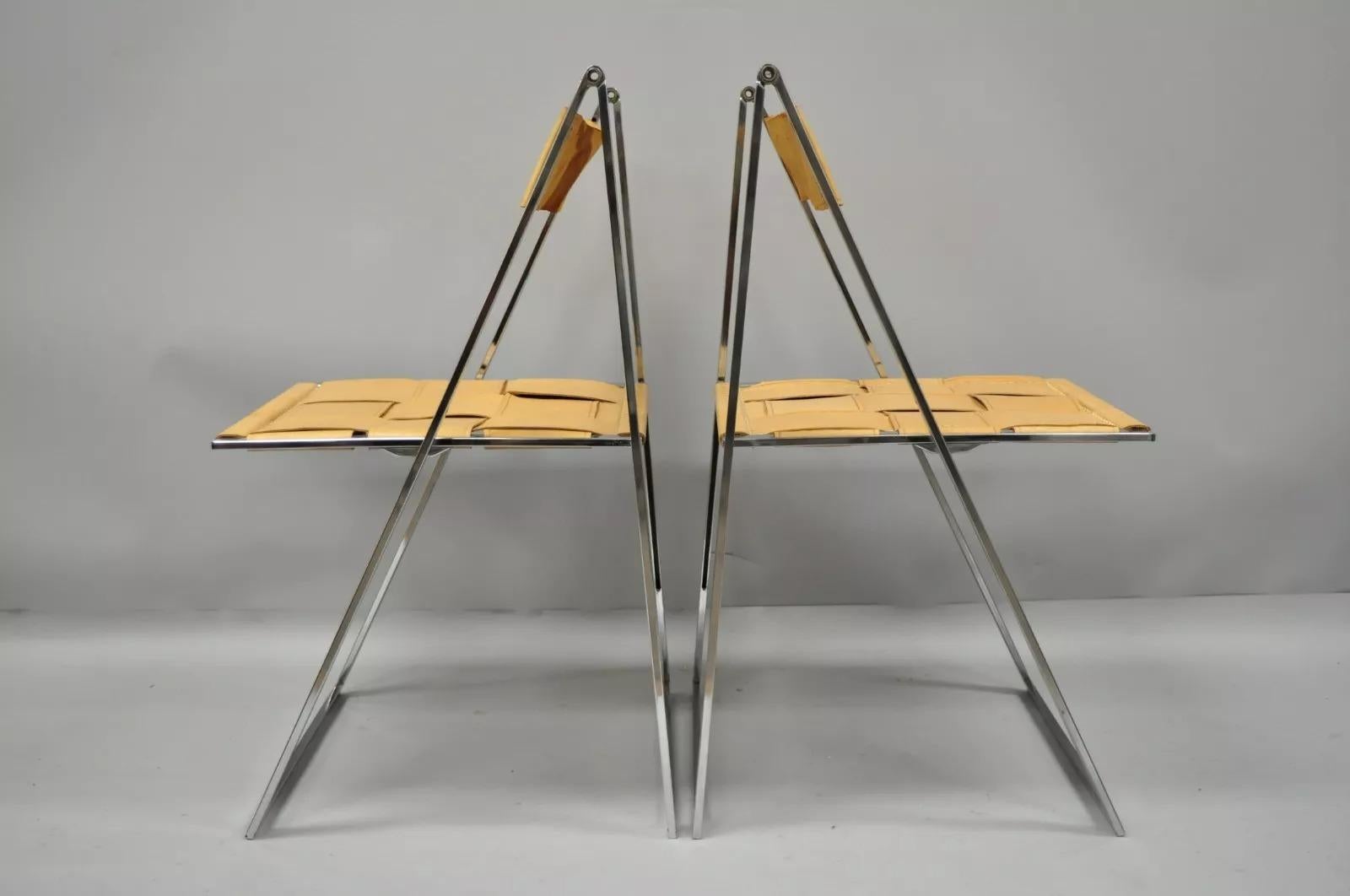 Fontoni & Geraci - Sedie moderne cromate e in pelle Elios Foldes (B) - Coppia. L'articolo è caratterizzato da un'elegante forma modernista, seduta e schienale in pelle spessa e marrone cuciti, telai pieghevoli in metallo cromato, stile e forma