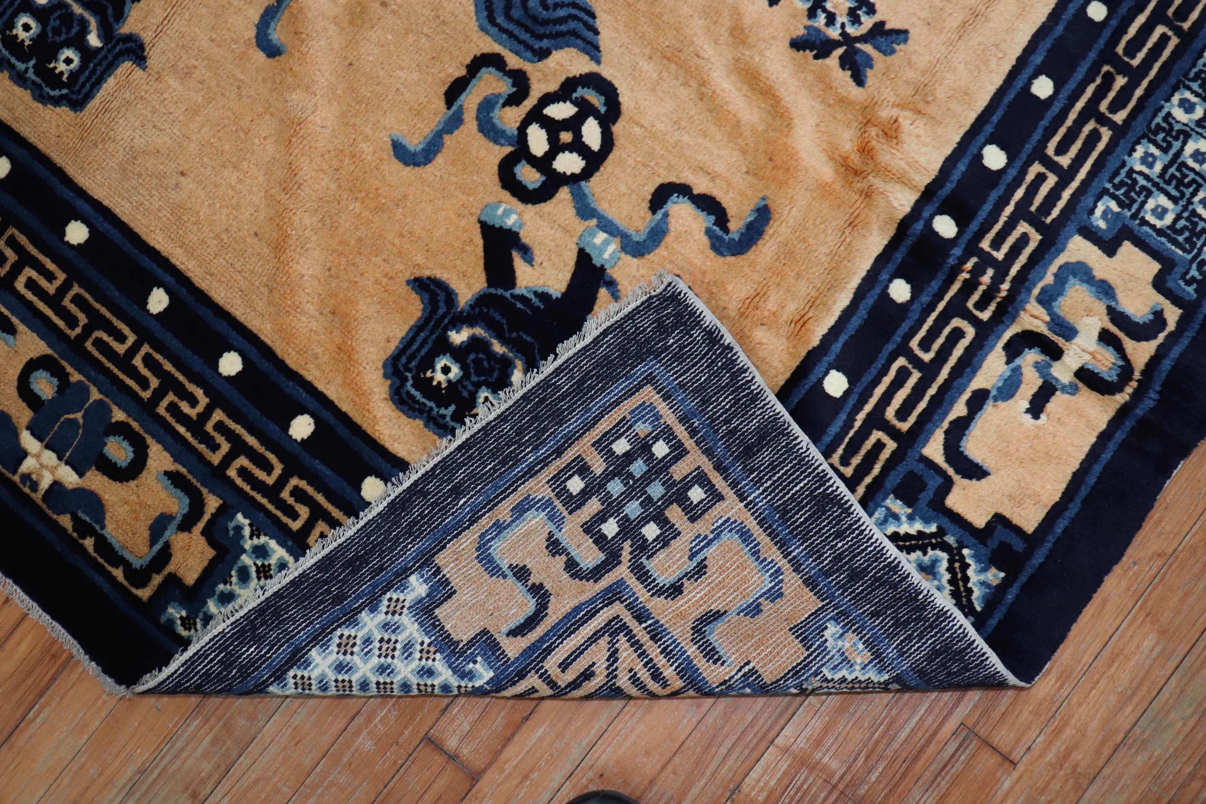 Compelling Chinese rug with a motif full of happy foo dogs, circa 1940. The field is a peach tone, with navy and light blue accents

Measures: 5'3