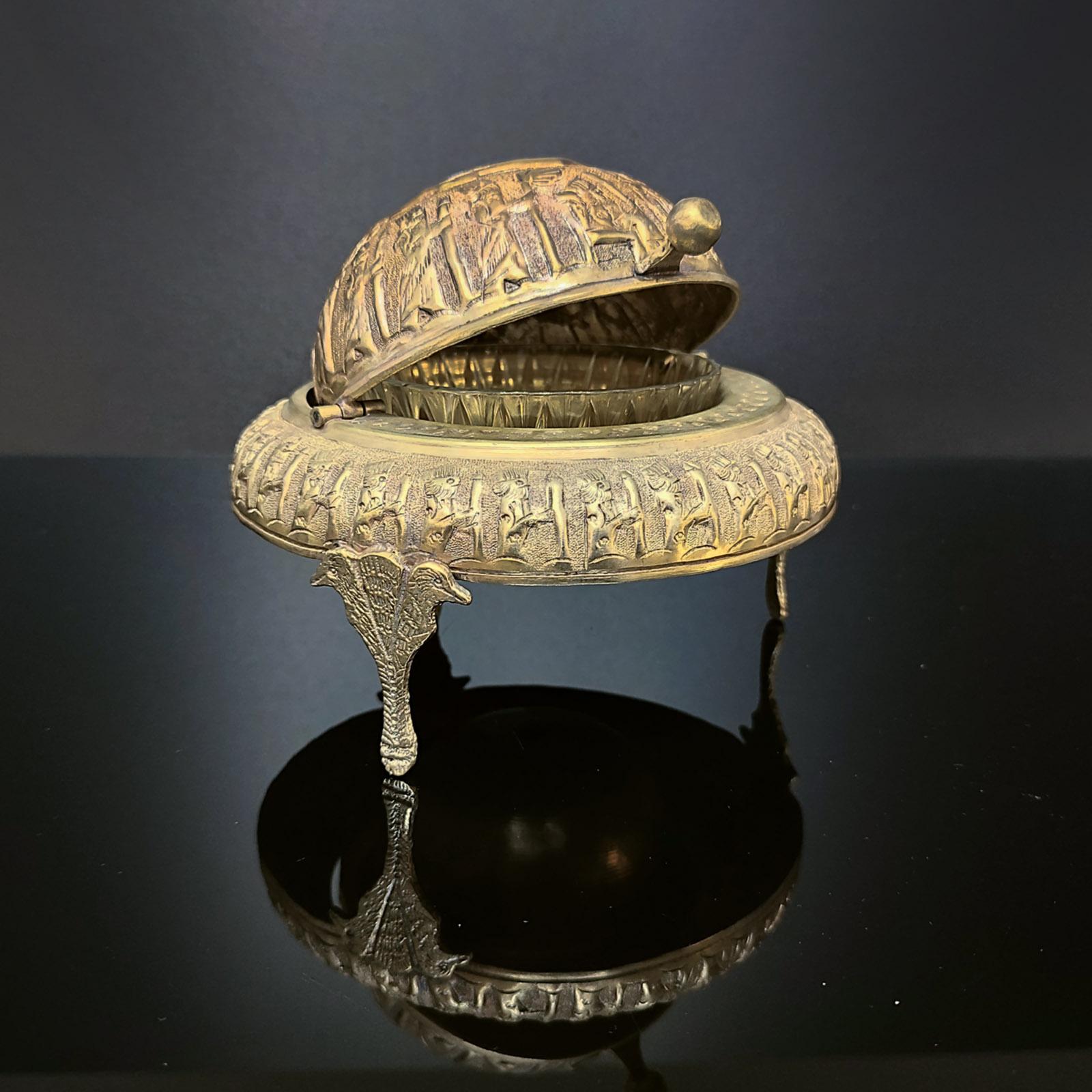 Handcrafted brass bowl, roll top round dome with rich Persian style design.
This footed presentation brass dish keeps inside a crystal bowl which makes it the perfect caviar server. Decorated with Persian scenes all around. Faded old silver plating