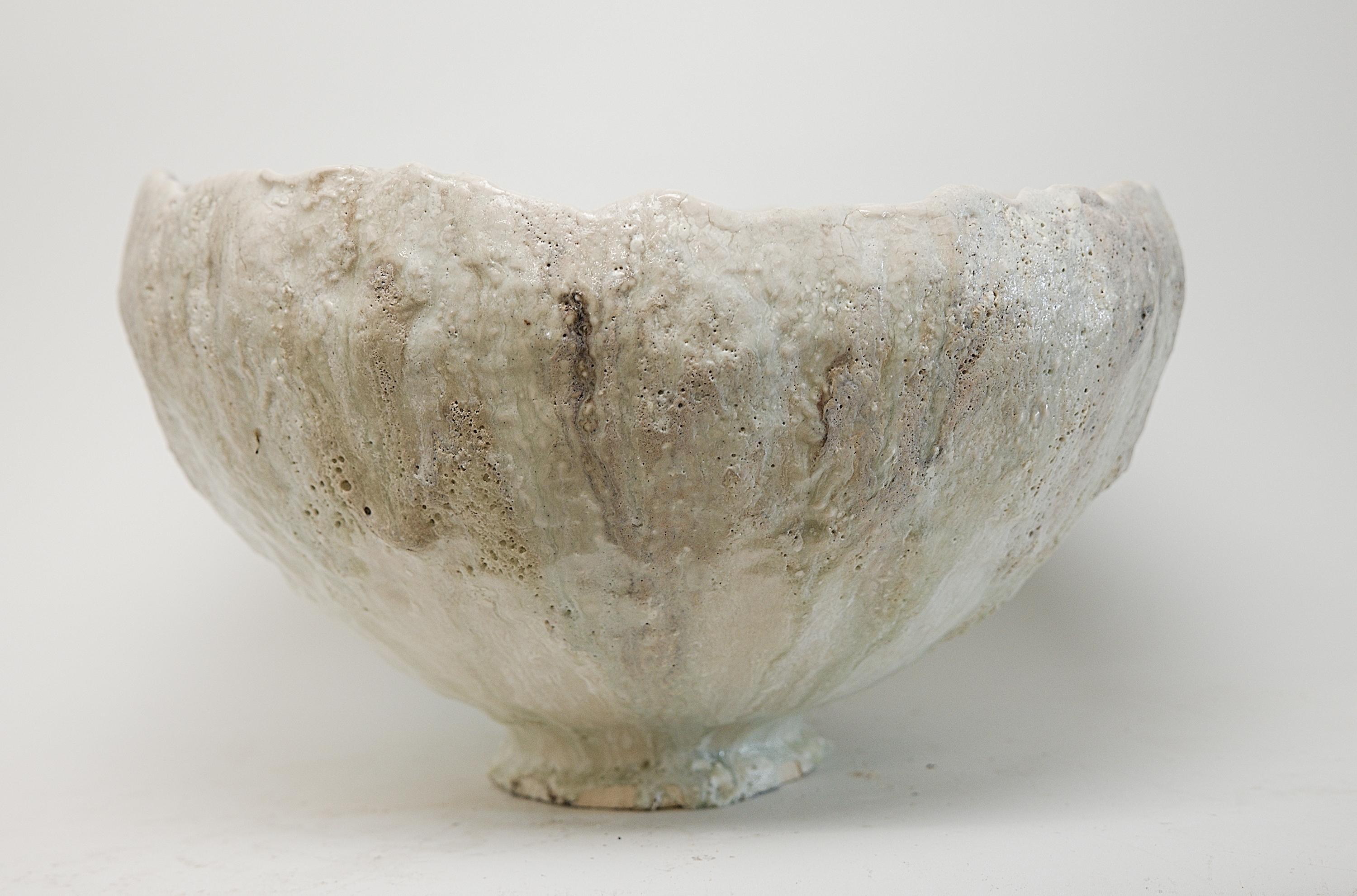 Discover the Relics Large Low Stoneware Planter Bowl, the perfect large sized bowl to use as a planter for orchids or other succulents on your table. This exquisite piece is handcrafted from stoneware clay and adorned with a crackle matte off-white