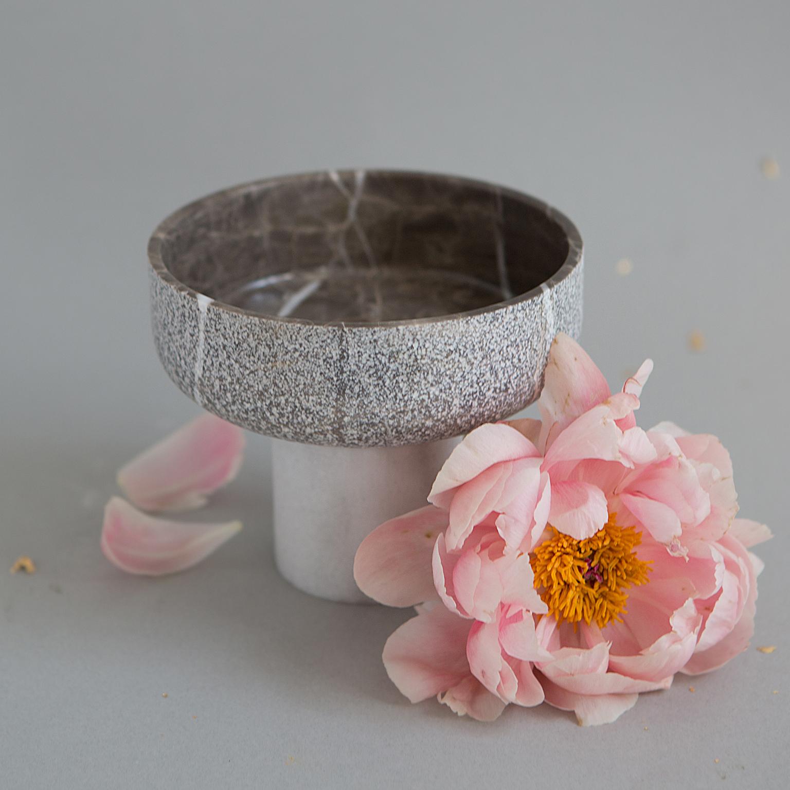 This contemporary footed bowl is made from grey marble, and its base is made from dolomite. Both materials are sourced from a family-owned quarry in southern Turkey. The simplicity of form, pureness of the natural material and beauty of handcraft