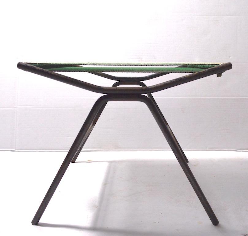 Iron and woven cord footstool, ottoman by Allan Gould. Classic midcentury architectural form, hard to find item. This example is structurally sound and sturdy, the finish shows wear, fading etc. normal and consistent with age.