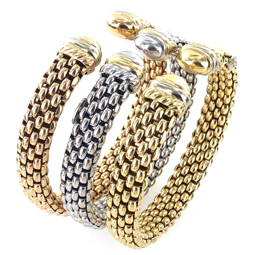 Modern Fope cuffs crafted in 18 karat gold. Each woven cuff measures 10mm in width and approximately 7 inches in circumference (they are for a smaller wrist size). White, rose, and yellow gold make up each of the three cuffs. Signed Fope 750 and