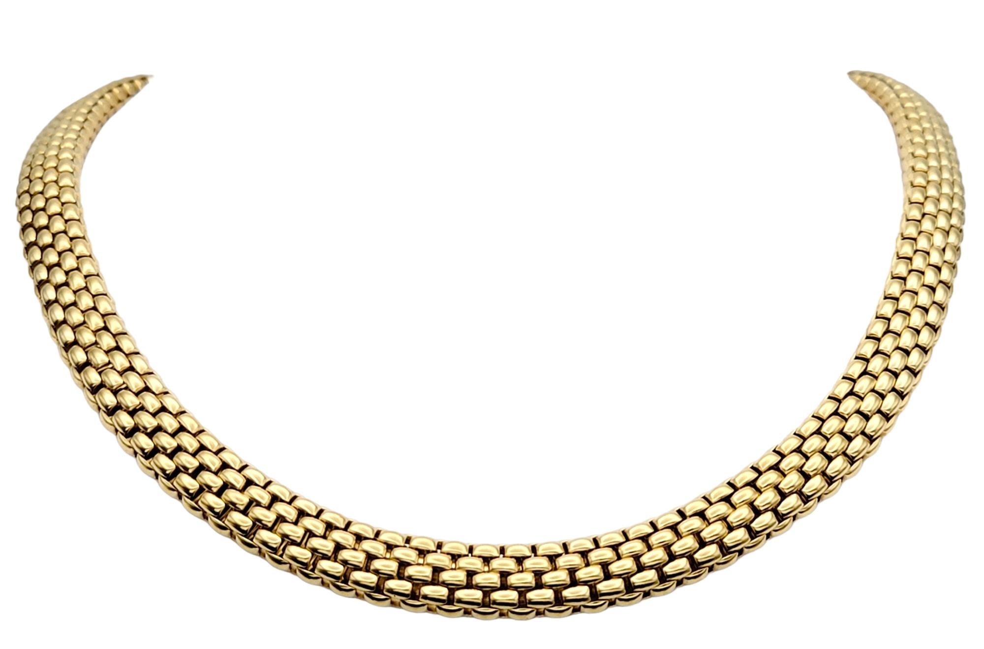 Introducing a truly exquisite piece of jewelry, the Fope Profili Collection woven mesh link choker necklace. Immerse yourself in the allure of unparalleled elegance with this stunning creation.

Crafted with precision and passion, this 16.5 inch