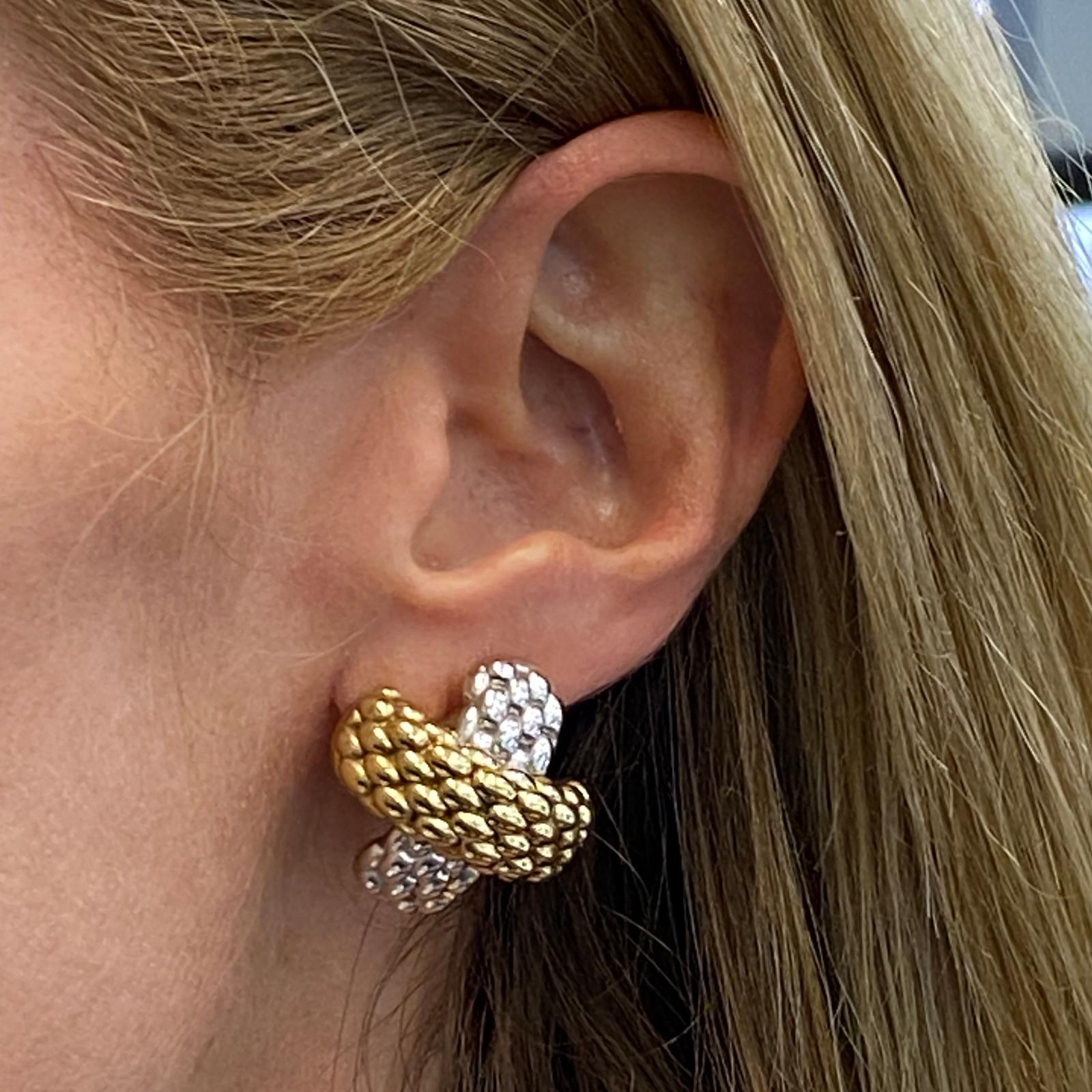 Fope quilted X earrings fashioned in 18 karat yellow and white gold. These classic earrings feature leverbacks and measure 20 x 22mm. Signed Fope 750 Italian hallmarks. 