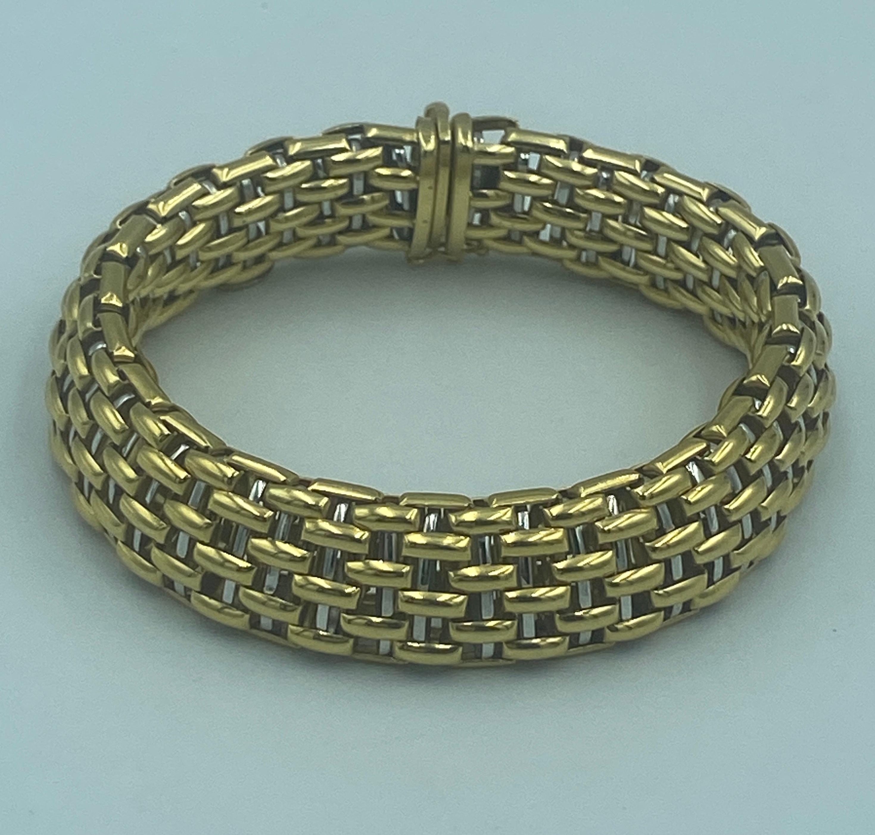 This elegant 1990s Fope bracelet is made up of woven strands of 18k gold. It is a most stylish piece and adds elegance to any outfit. It is part of a set with a necklace which is listed separately on 1stDibs.