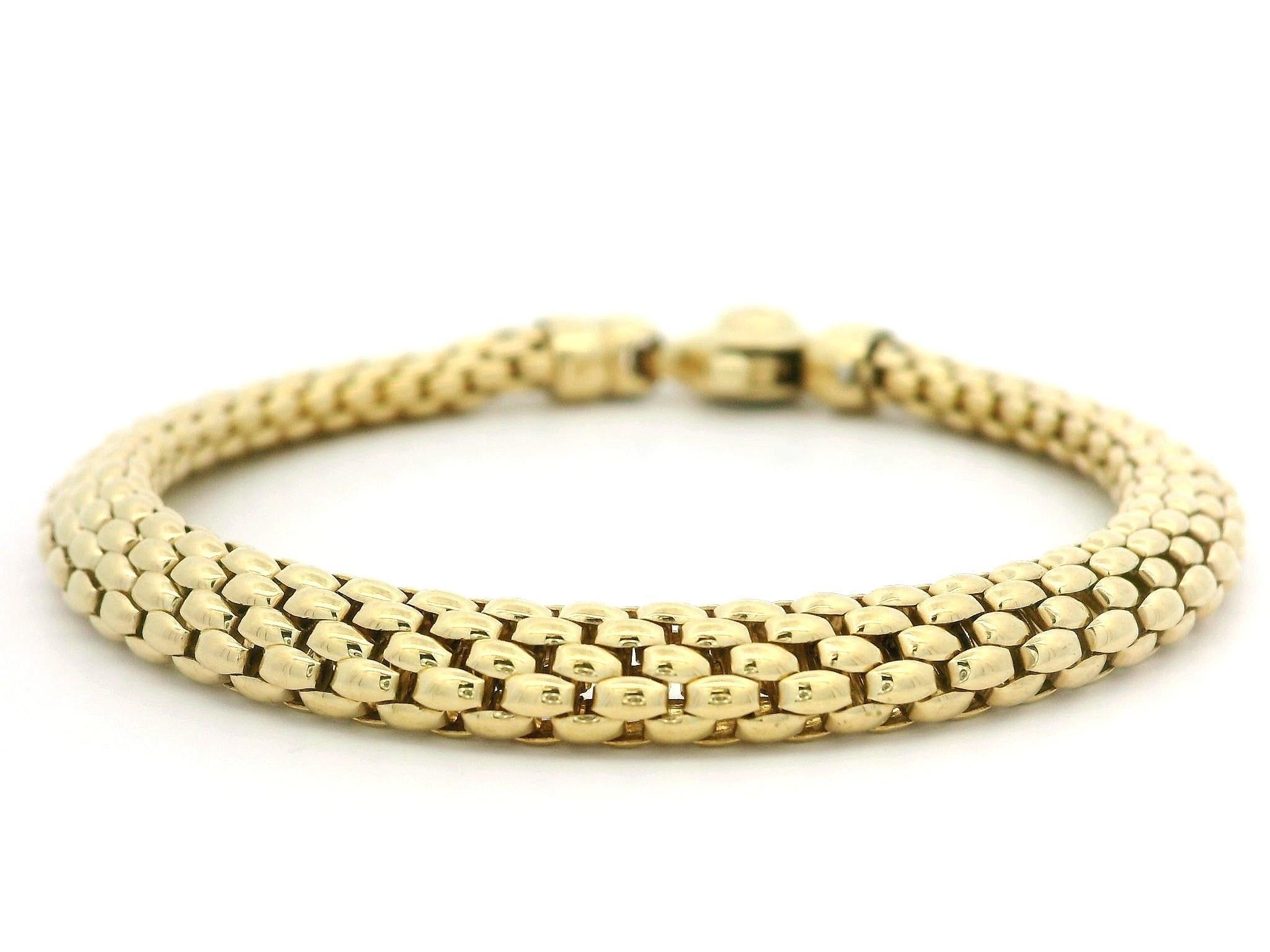 Material: 18K Solid Yellow Gold w/ White Gold Accents
Weight: 16.12 Grams
Length: Measure 6.5 Inches Next to a Ruler. Will comfortably fit up to a 6.25 inch wrist. (fitted on a wrist)
Clasp: Custom Lobster Claw Clasp
Width: 5.9mm (0.23