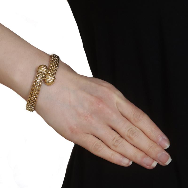 Brand: FOPE
Design: Bypass

Metal Content: 18k Yellow Gold & 18k White Gold

Style: Flexible Bypass Bangle
Chain Style: Panther
Bracelet Style: Chain
Fastening Type: N/A (slides over wrist)

Measurements
Inner Circumference: 6 1/2