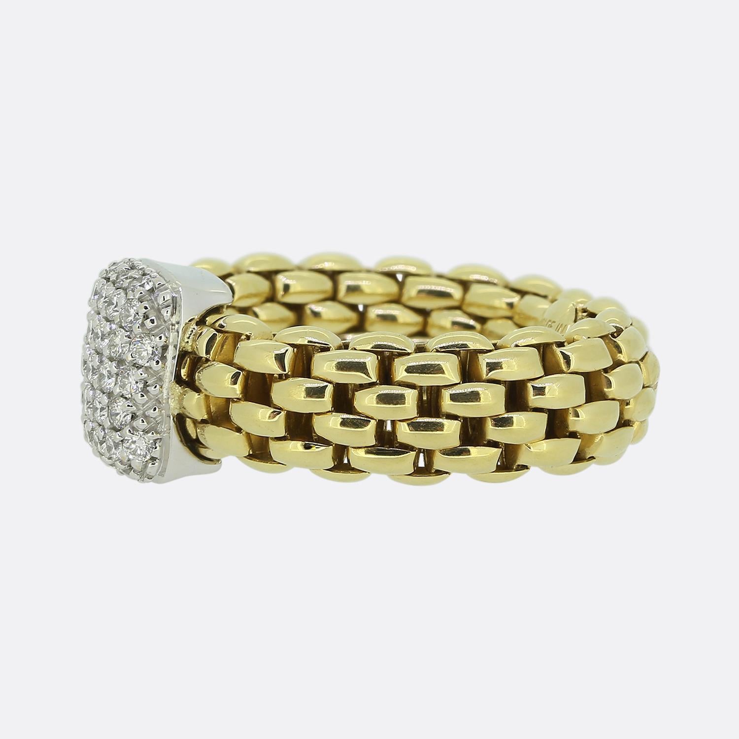 Here we have a stylish piece from the renowned Italian jewellery designer, Fope. This iconic piece features a flexible, woven band crafted from luxurious 18ct yellow gold with a centrepiece adorned with a cluster of round brilliant cut diamonds,