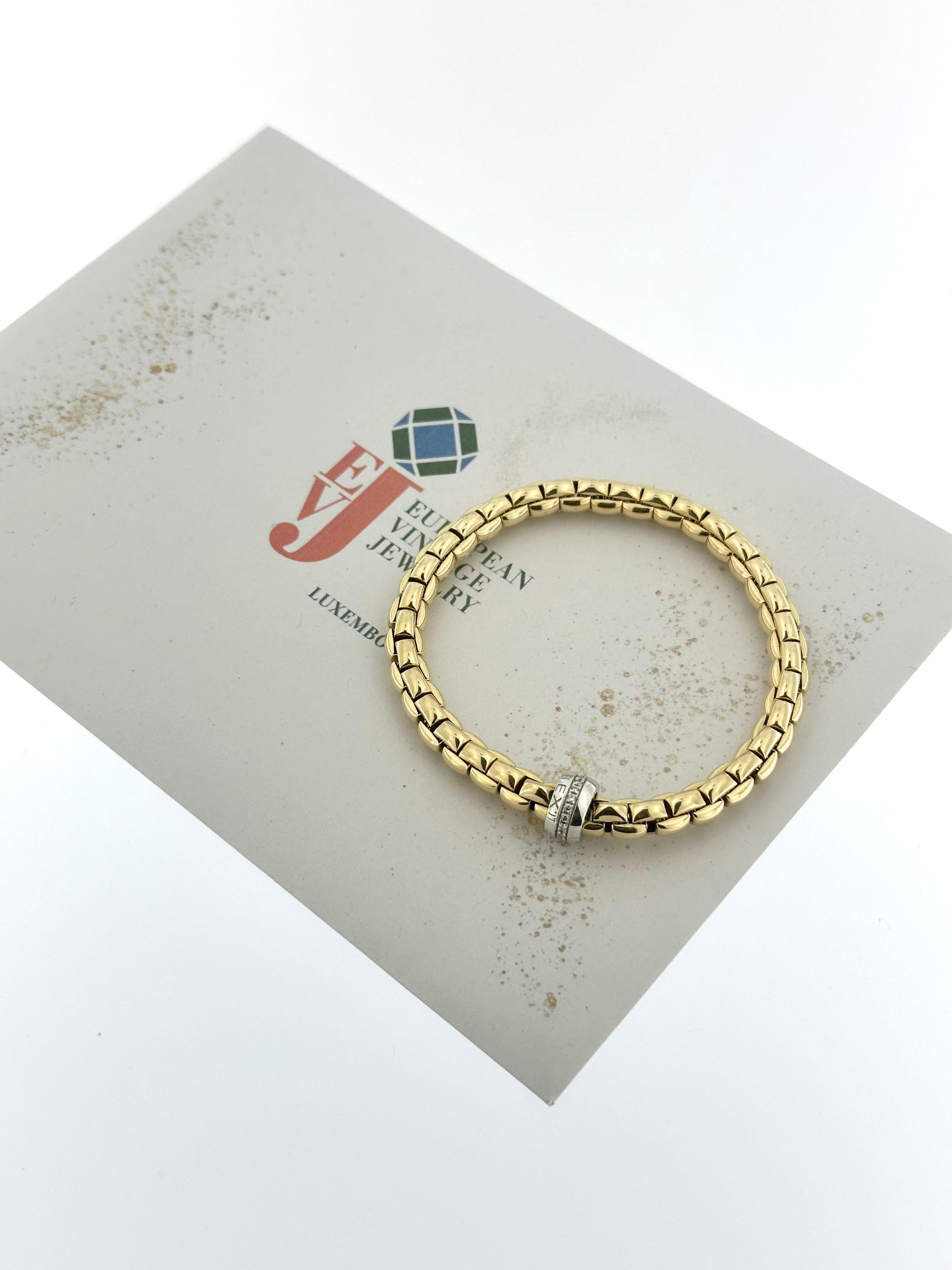 This Fope Flex Bracelet is an exquisite example of luxury and innovation, crafted from a combination of 18-karat yellow and white gold. Known for its flexible and stretchable design, this bracelet offers both elegance and comfort with no clasp,