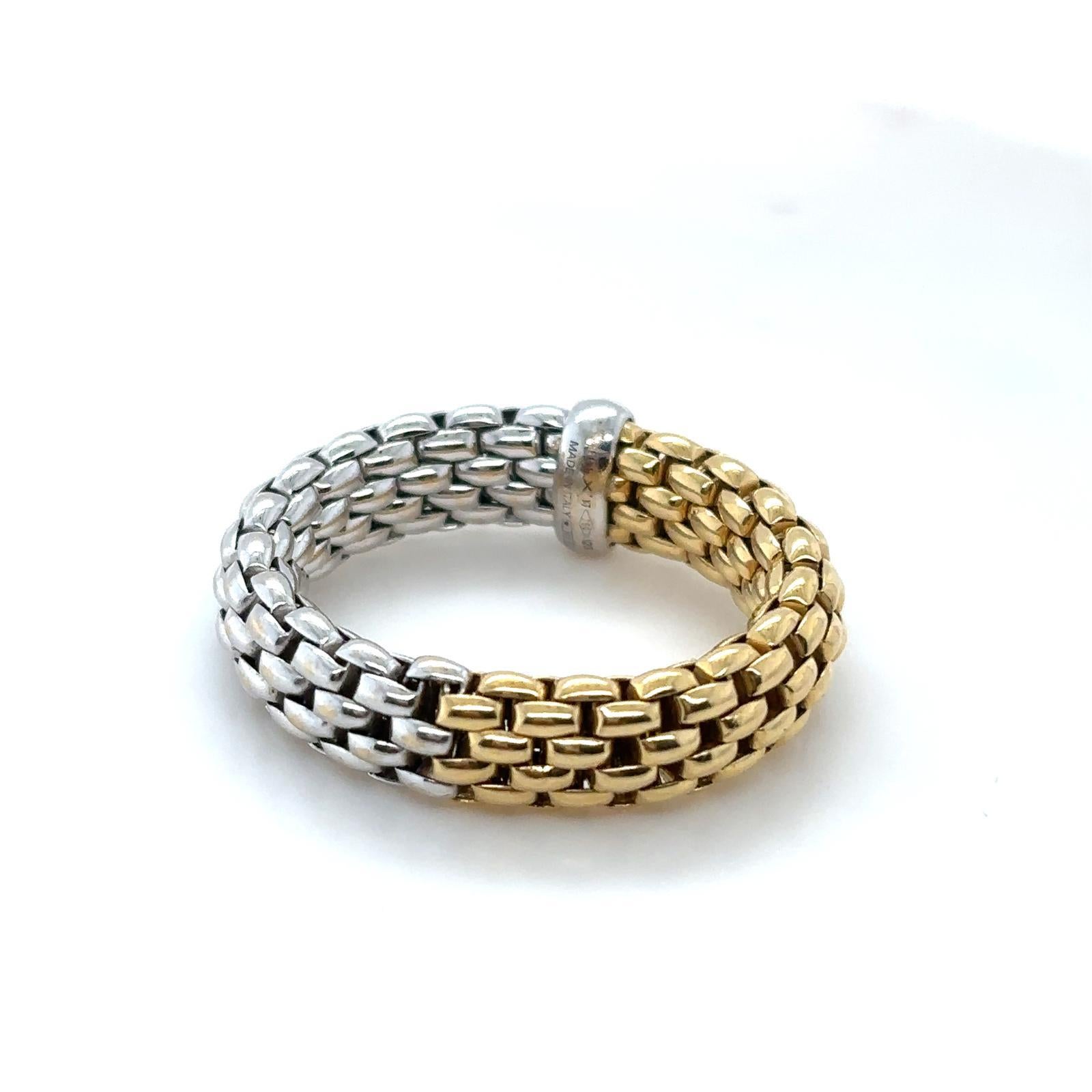 A Fope Flex'it ring in 18 karat white and yellow gold

This elegant ring is crafted in flexible 18ct yellow gold and white gold and is accentuated with a highly polished 18ct white gold rondel to its centre. The Flex'it collection is a unique piece