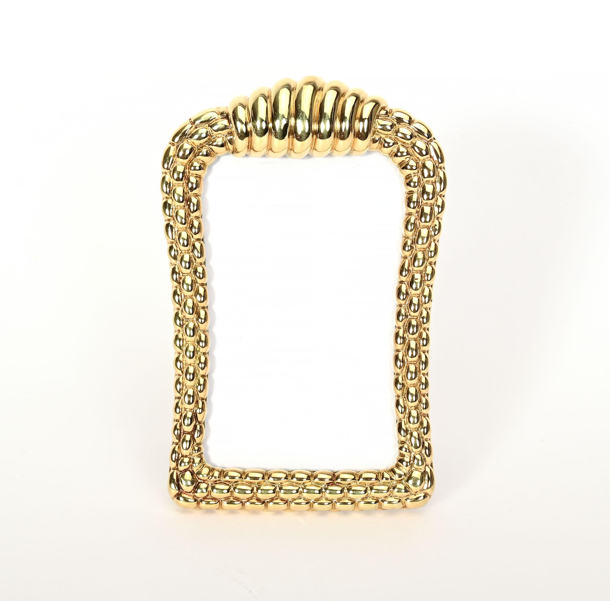 How better to remember a special  person or event than in this elegant gold picture frame by Fope Gioielli?  Fope has been creating fine jewelry in Venice since 1929. The sculptural design of this frame is much like the link bracelets for which they