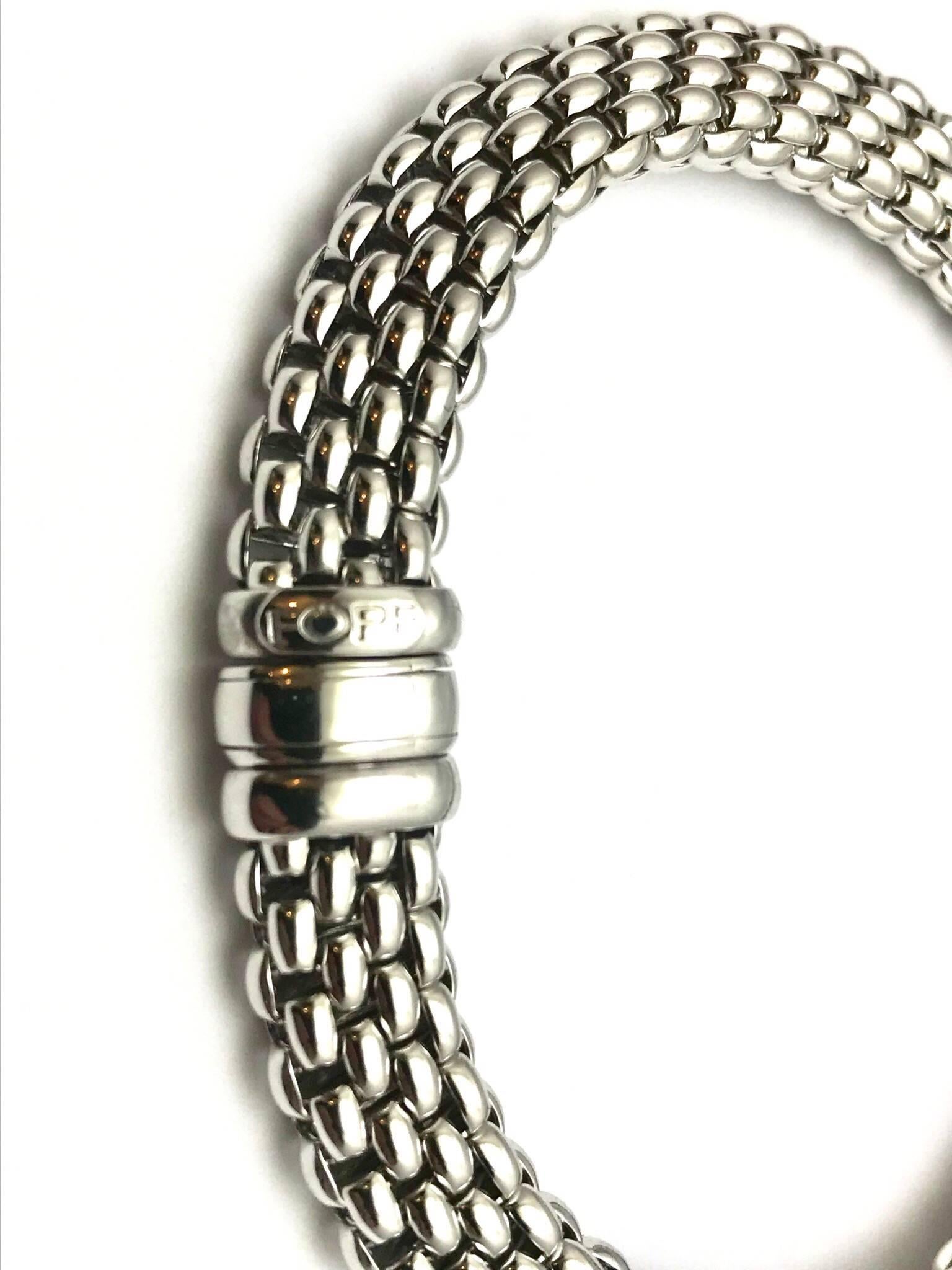 A Fope Italian designed 18 karat white gold bracelet.  The bracelet is designed with woven links, creating a very soft feel, and measures 10.00mm wide.  The bracelet is 8.25 inches in length.  

Signature:  FOPE
Hallmark:  750