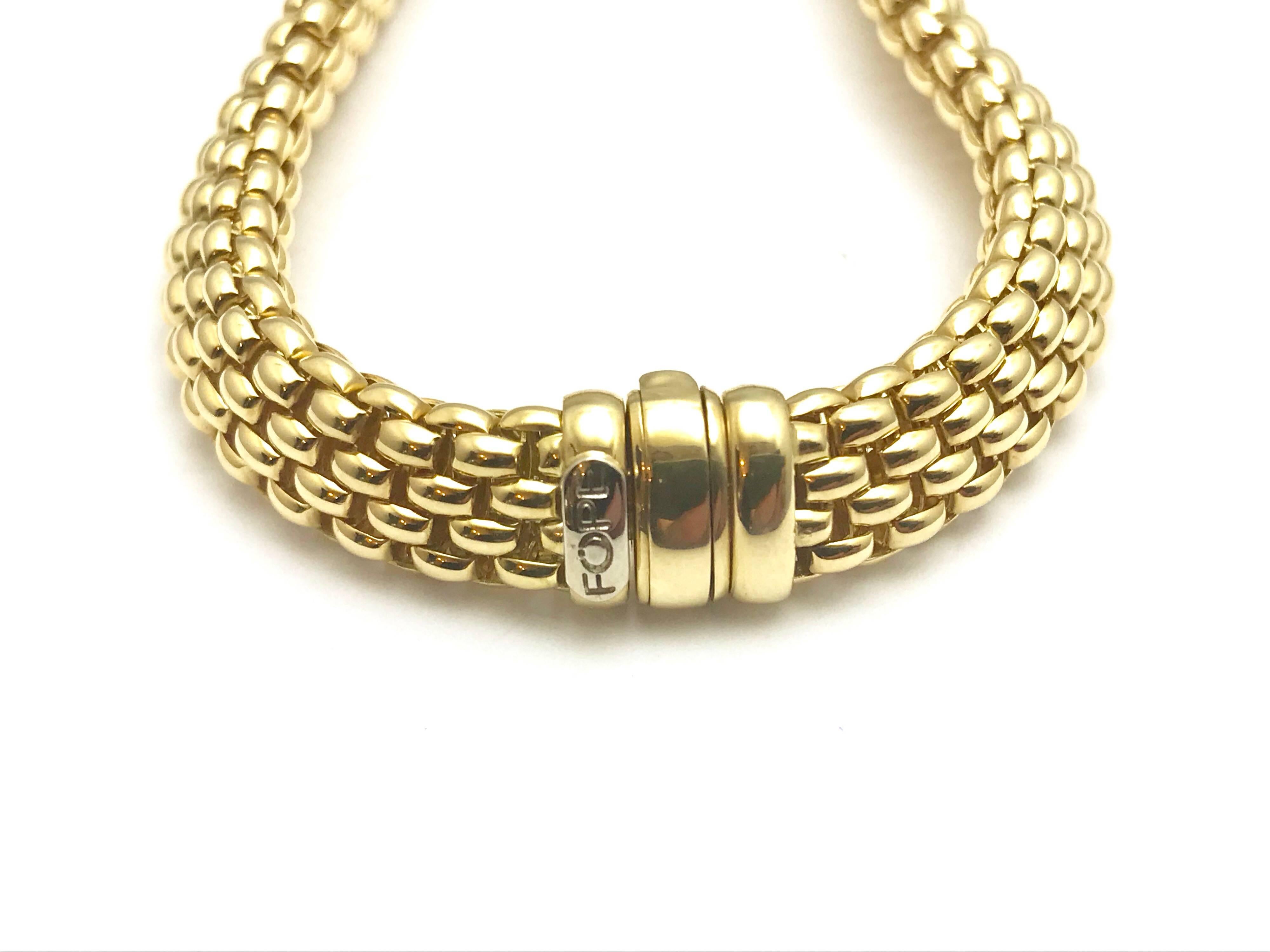 A Fope Italian designed 18 karat yellow gold bracelet. The bracelet is designed with woven links, creating a very soft feel, and measures 10.00mm wide. The bracelet is 7.50 inches in length. 

Signature: FOPE
Hallmark: 750
