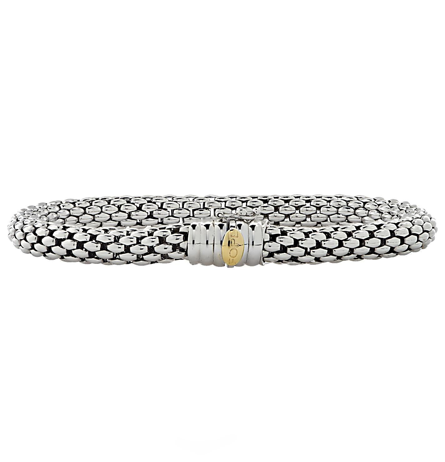 Fope Flex ‘it bracelet crafted by hand in Italy in 18 karat white gold with a yellow gold detail. This stunning woven white gold flexible tube bracelet detailed with rondelles glides around the wrist wrapping it in luxury and sophistication