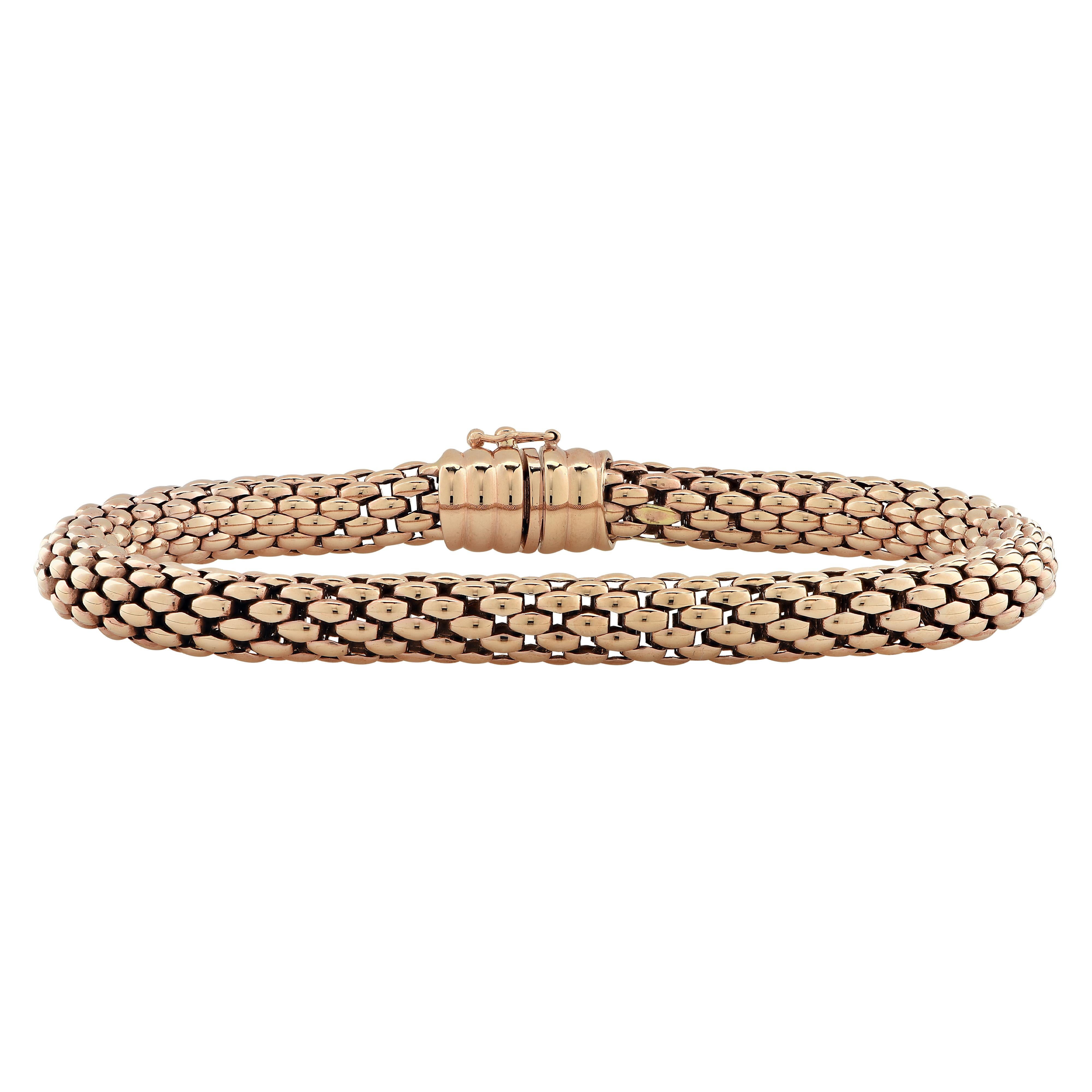 Fope Flex ‘it bracelet crafted by hand in Italy in 18 karat rose gold with white gold details. This stunning woven rose gold flexible tube bracelet detailed with rose gold rondelles glides around the wrist wrapping it in luxury and sophistication