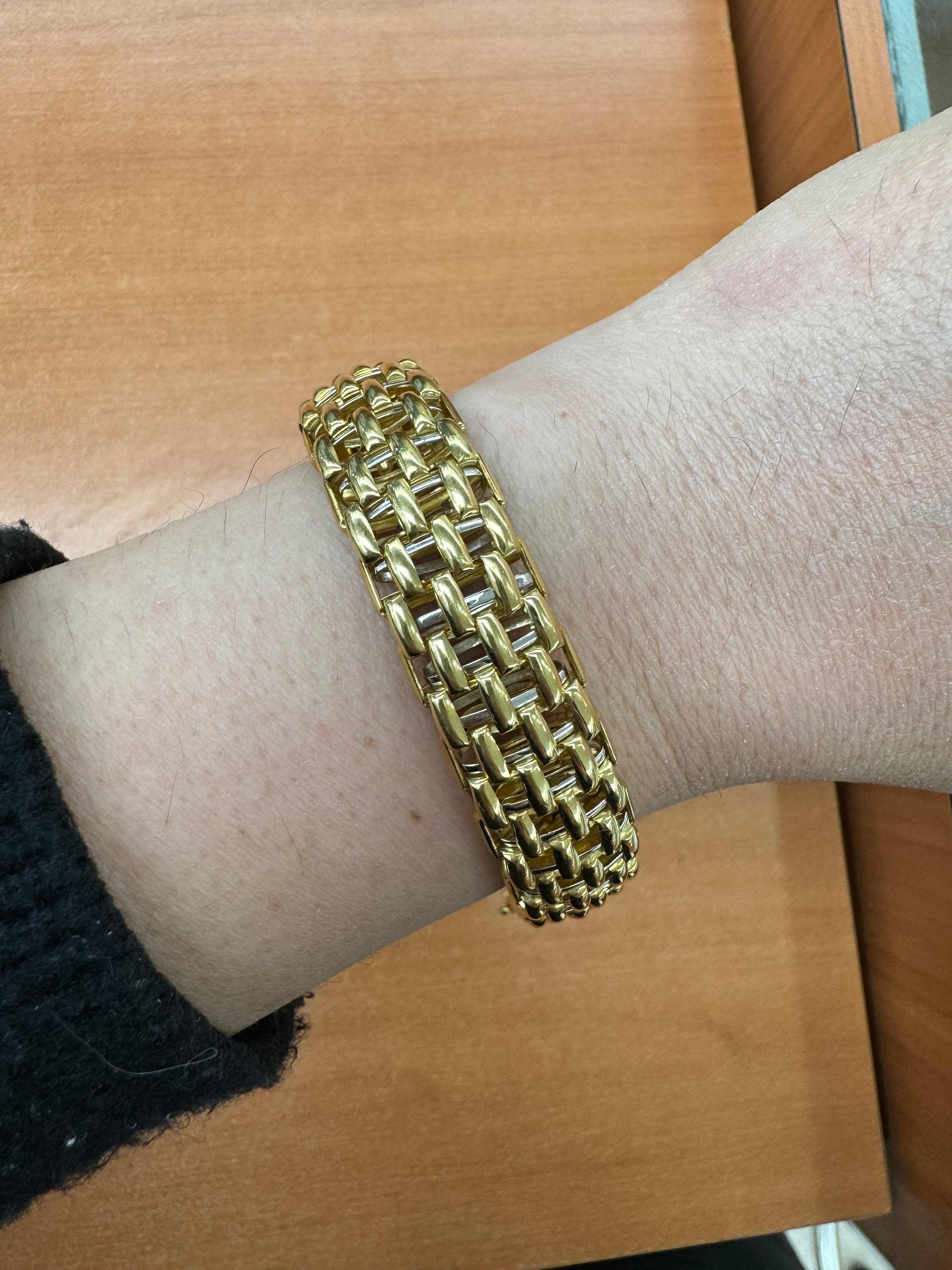 Designer Fope, this 18 karat yellow gold bracelet features a two-tone woven bracelet motif weighing 49.2 grams. 
8 inches