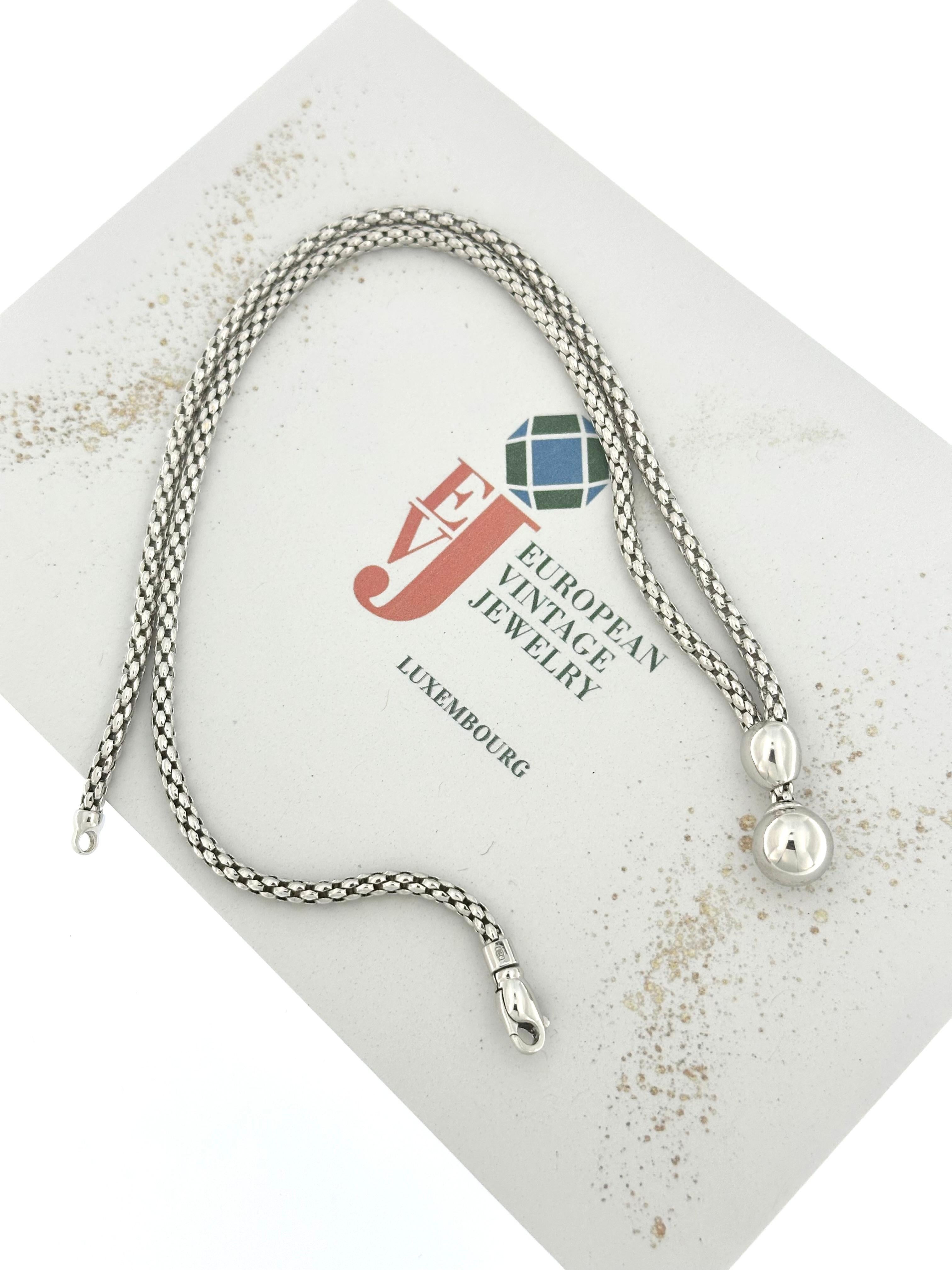 This Fope White Gold Fashion Pendant Necklace is a stunning piece of Italian craftsmanship, combining timeless elegance with modern design. Made from luxurious 18-karat white gold, the necklace features Fope's signature mesh design, known for its