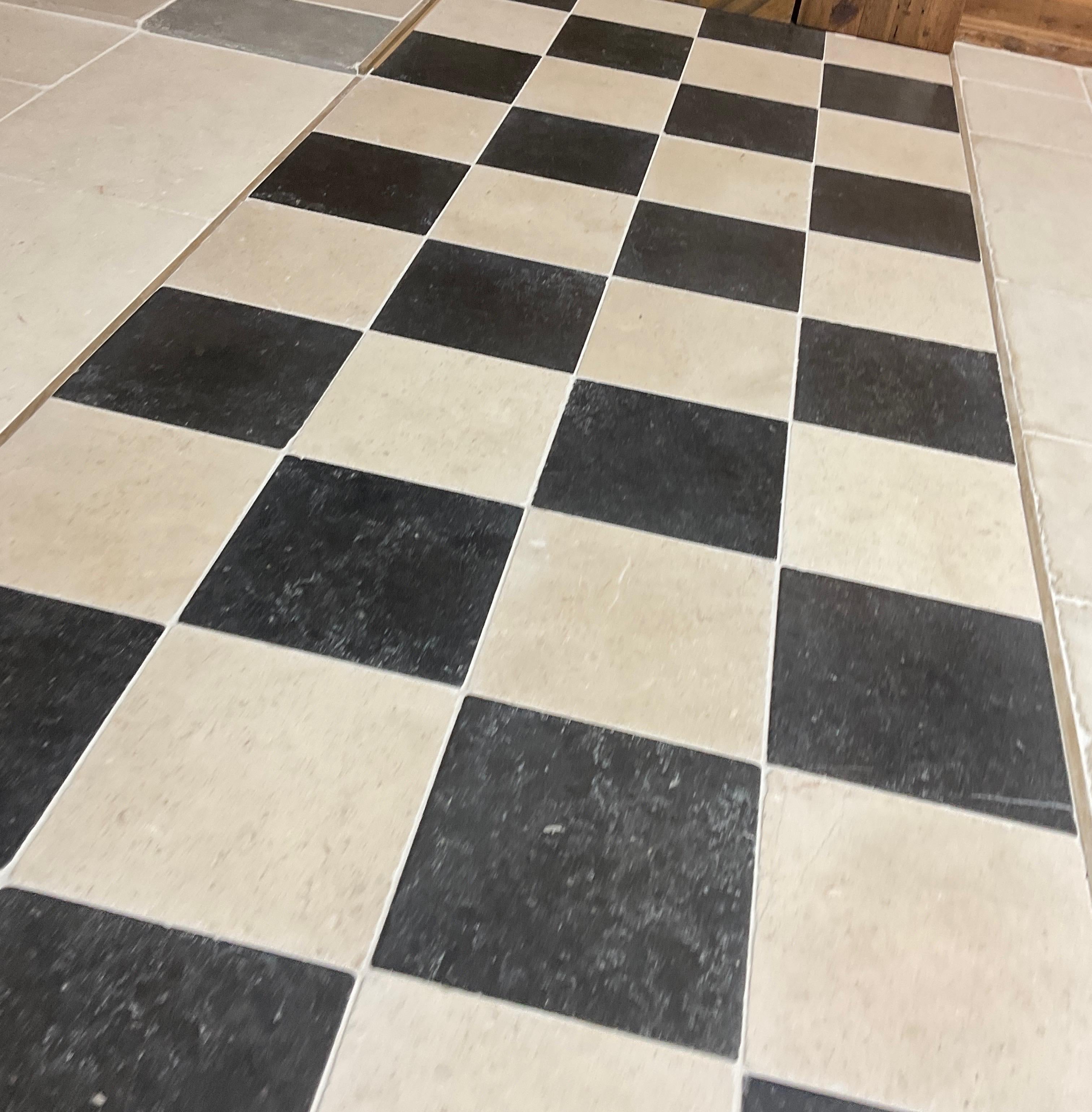 Black and white limestone checkerboard flooring

Origin: France

Measurements: 16