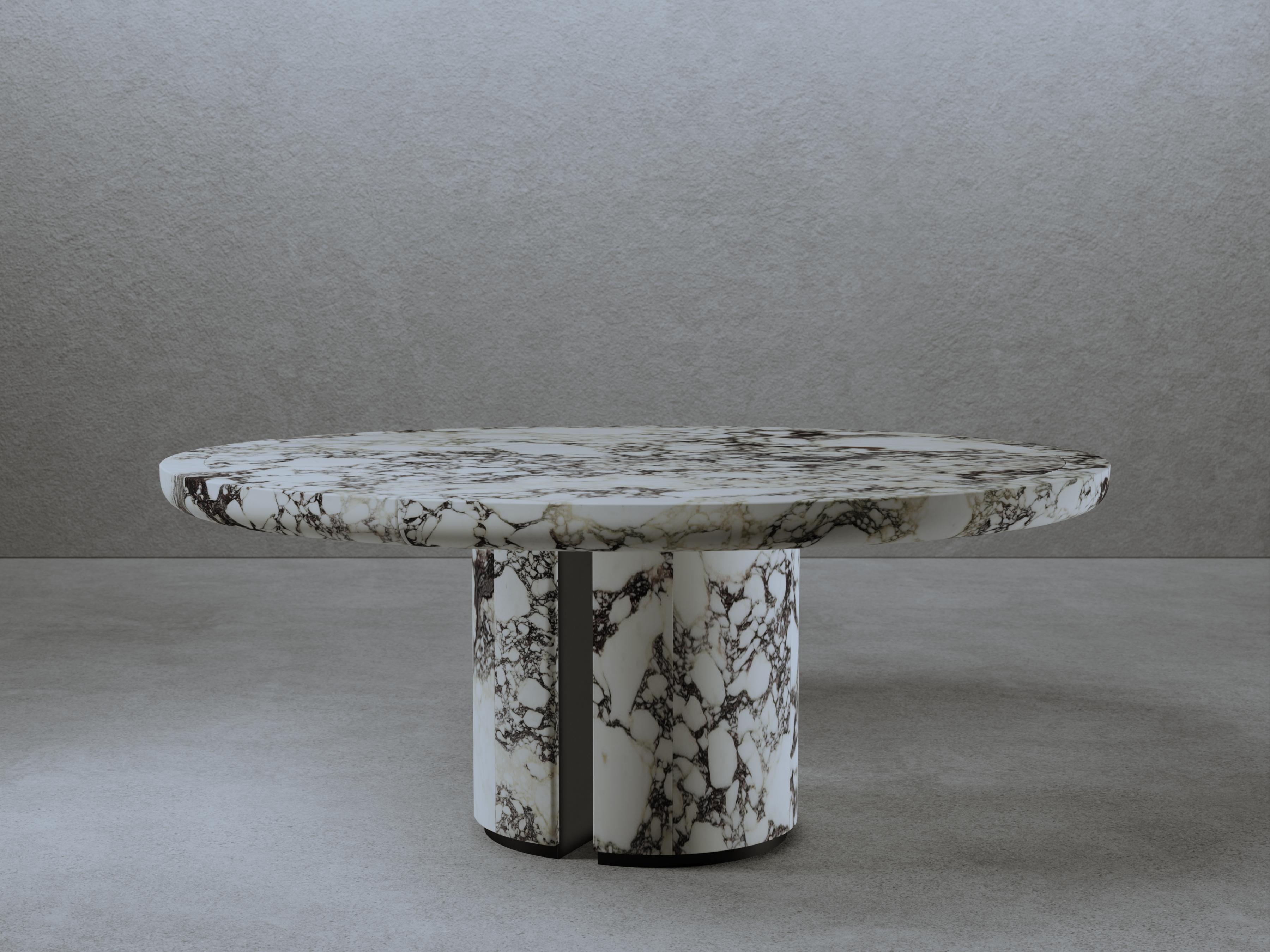 For No One Dining Table by Gio Pagani
Dimensions: Ø 180 x H 74 cm.
Materials: Calacatta Viola Marble and matte black metal.

In a fluid society capable of mixing infinite social and cultural varieties, the nostalgic search for reworked aesthetics