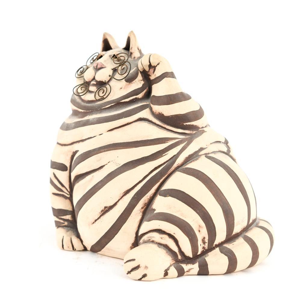 This wonderful whimsical fat cat piggy bank with copper color is signed underneath. Use it as a sculpture, a decorative item or a place for all your loose change!

 